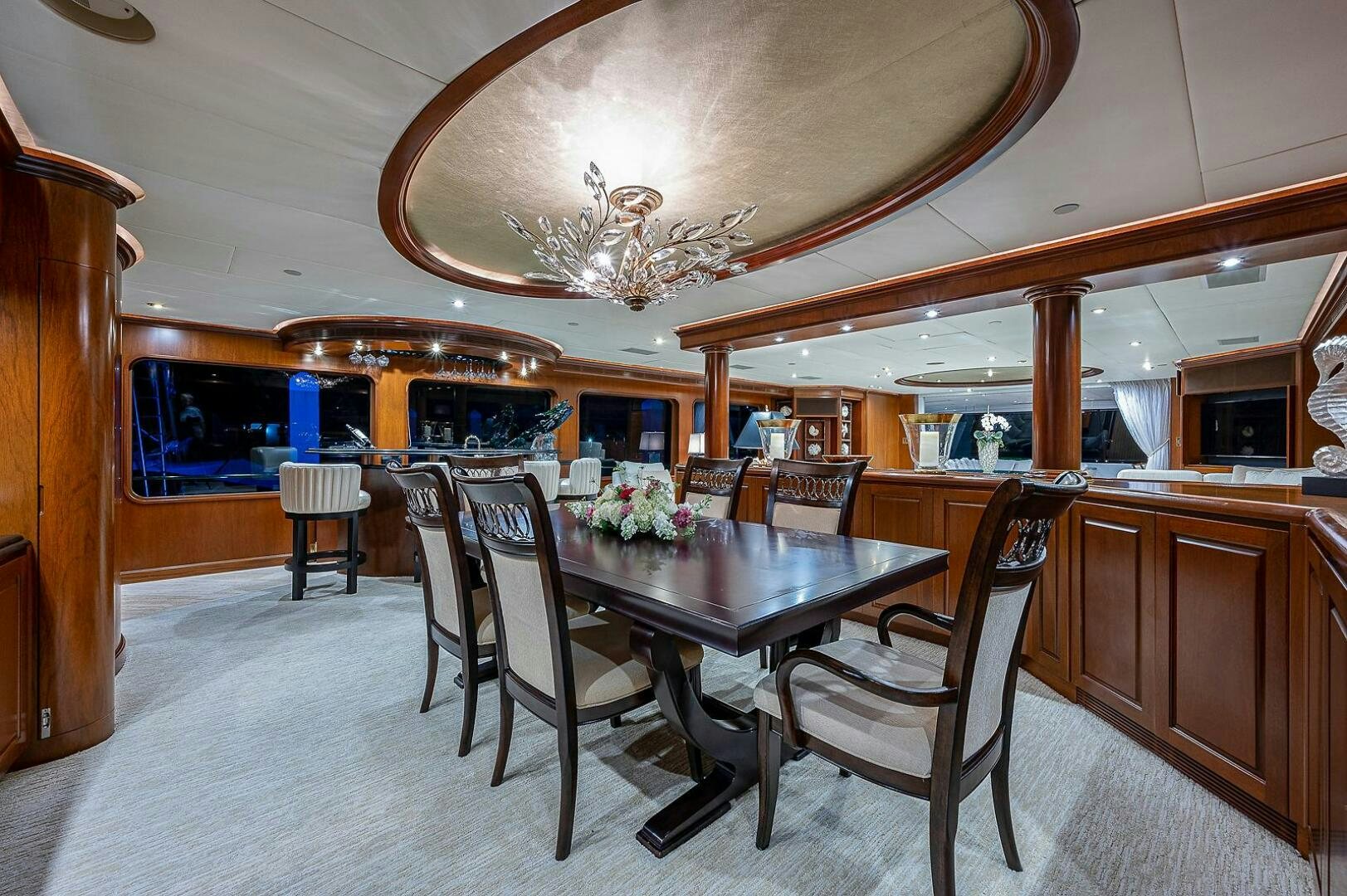 a dining room with a chandelier above it aboard LA SIRENA Yacht for Sale