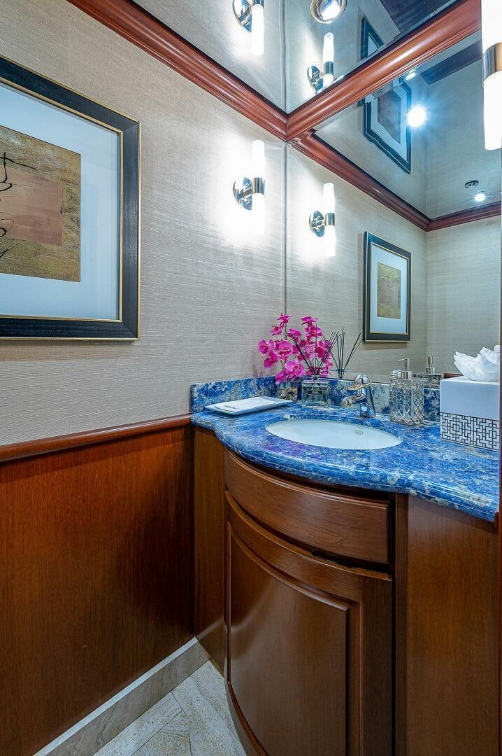 a bathroom with a sink and mirror aboard LA SIRENA Yacht for Sale