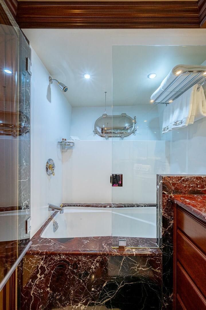 a bathroom with a shower and sink aboard LA SIRENA Yacht for Sale