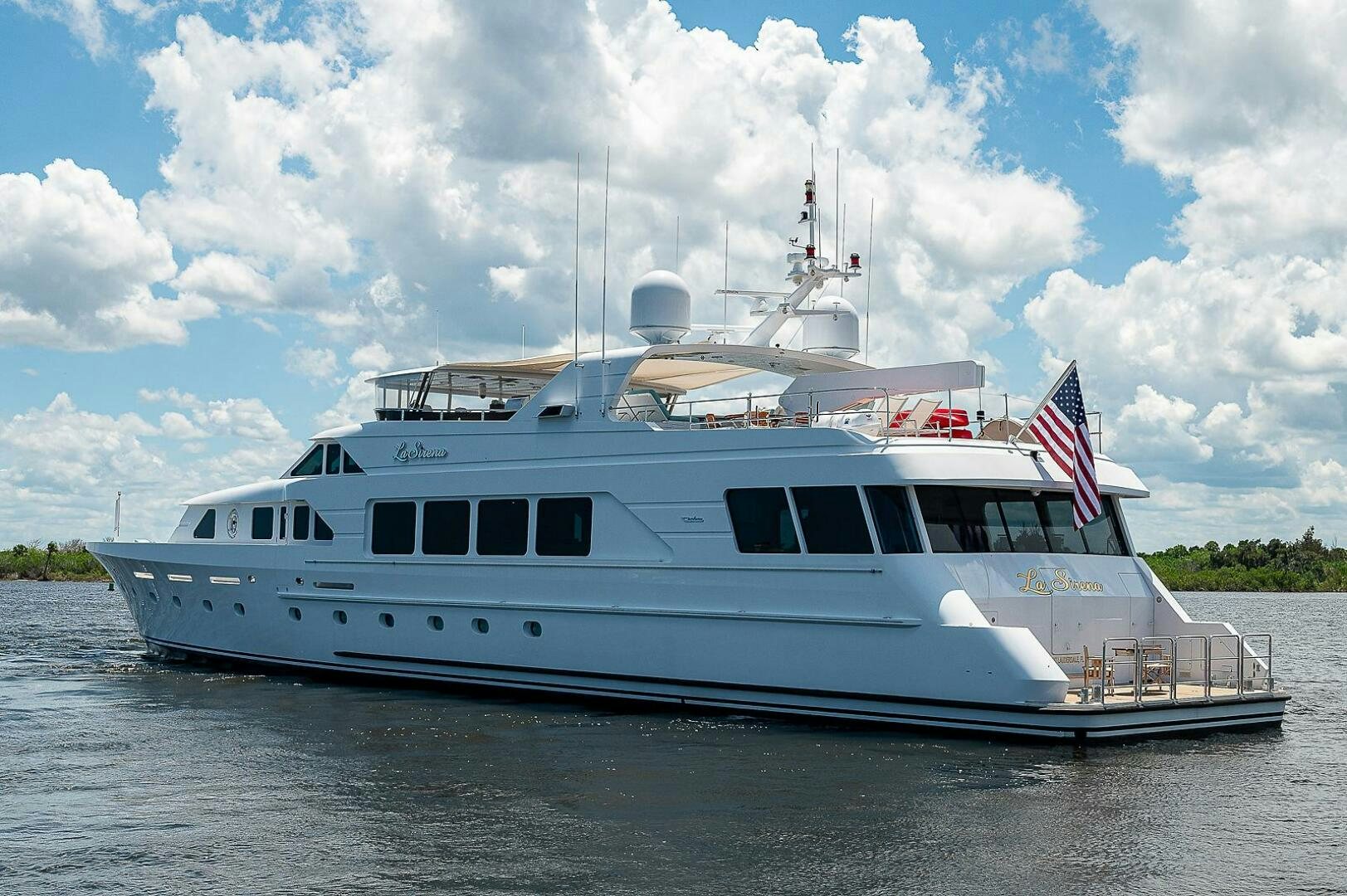 a large white boat on the water aboard LA SIRENA Yacht for Sale