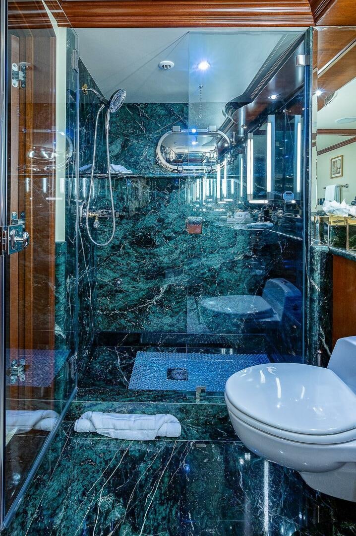 a bathroom with a glass shower aboard LA SIRENA Yacht for Sale