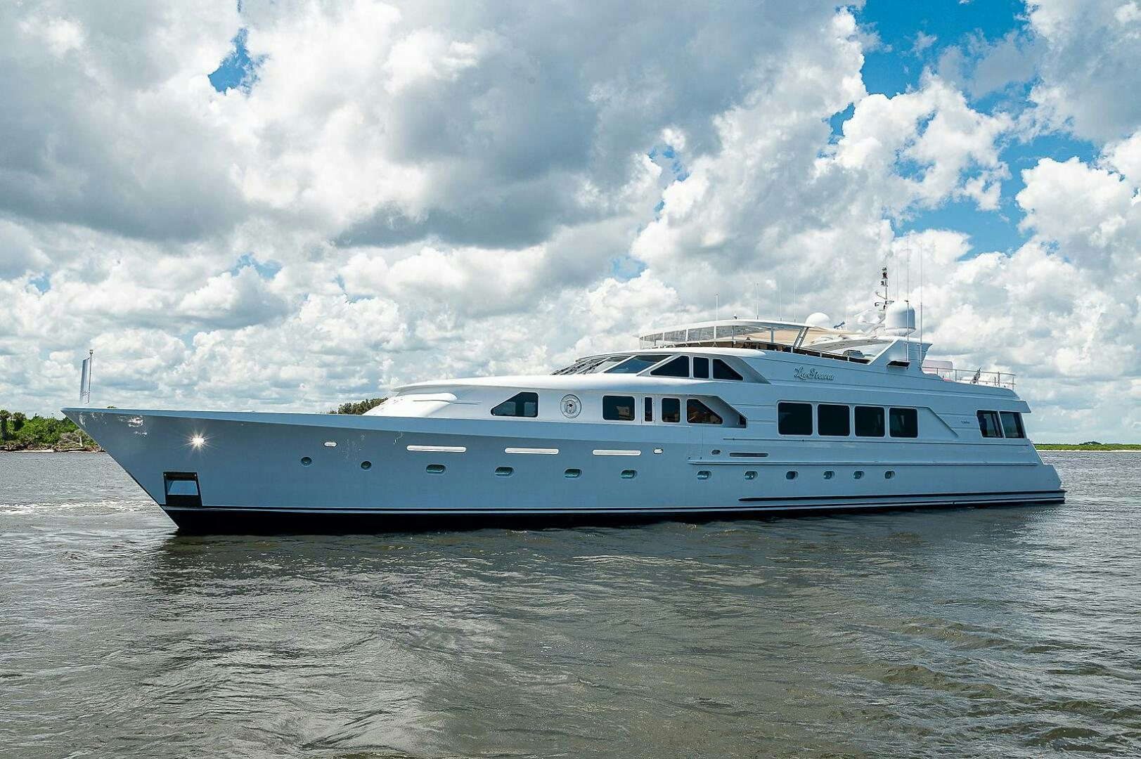 a white yacht on the water aboard LA SIRENA Yacht for Sale