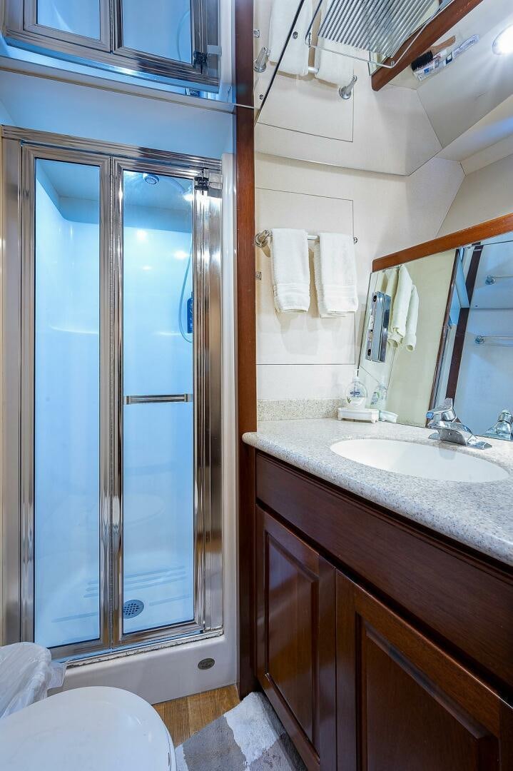 a bathroom with a glass shower aboard LA SIRENA Yacht for Sale