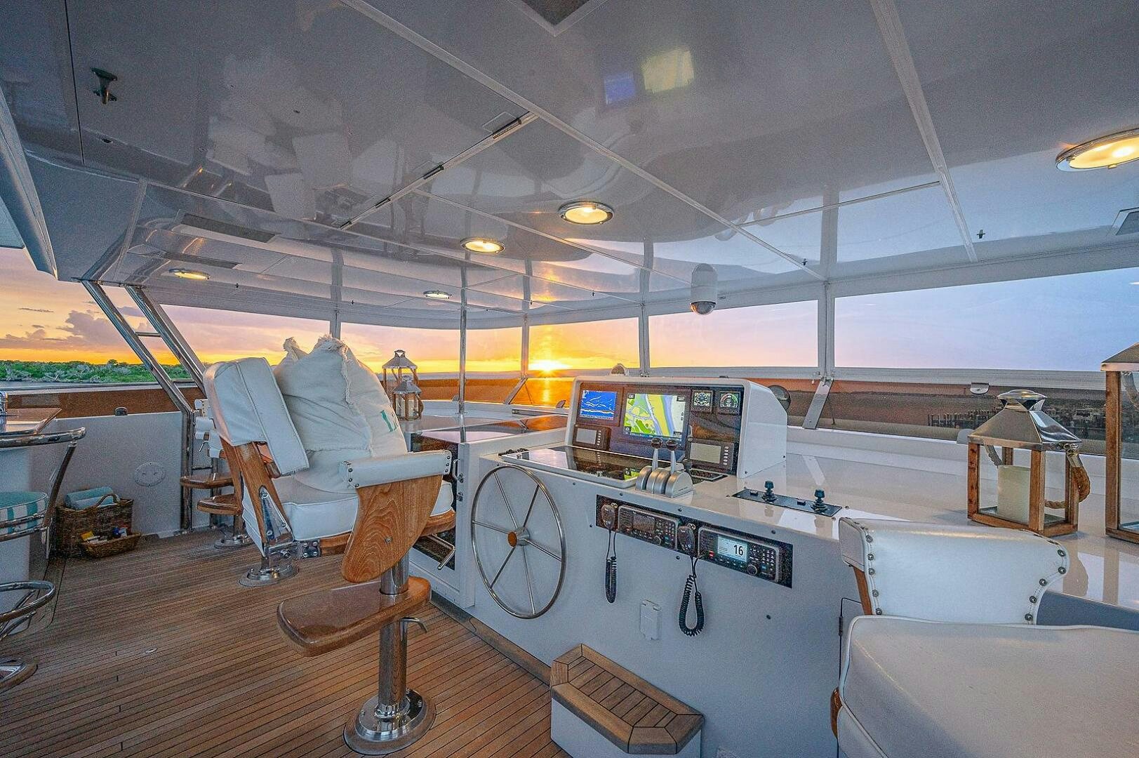 a room with a large table and chairs and a large window aboard LA SIRENA Yacht for Sale