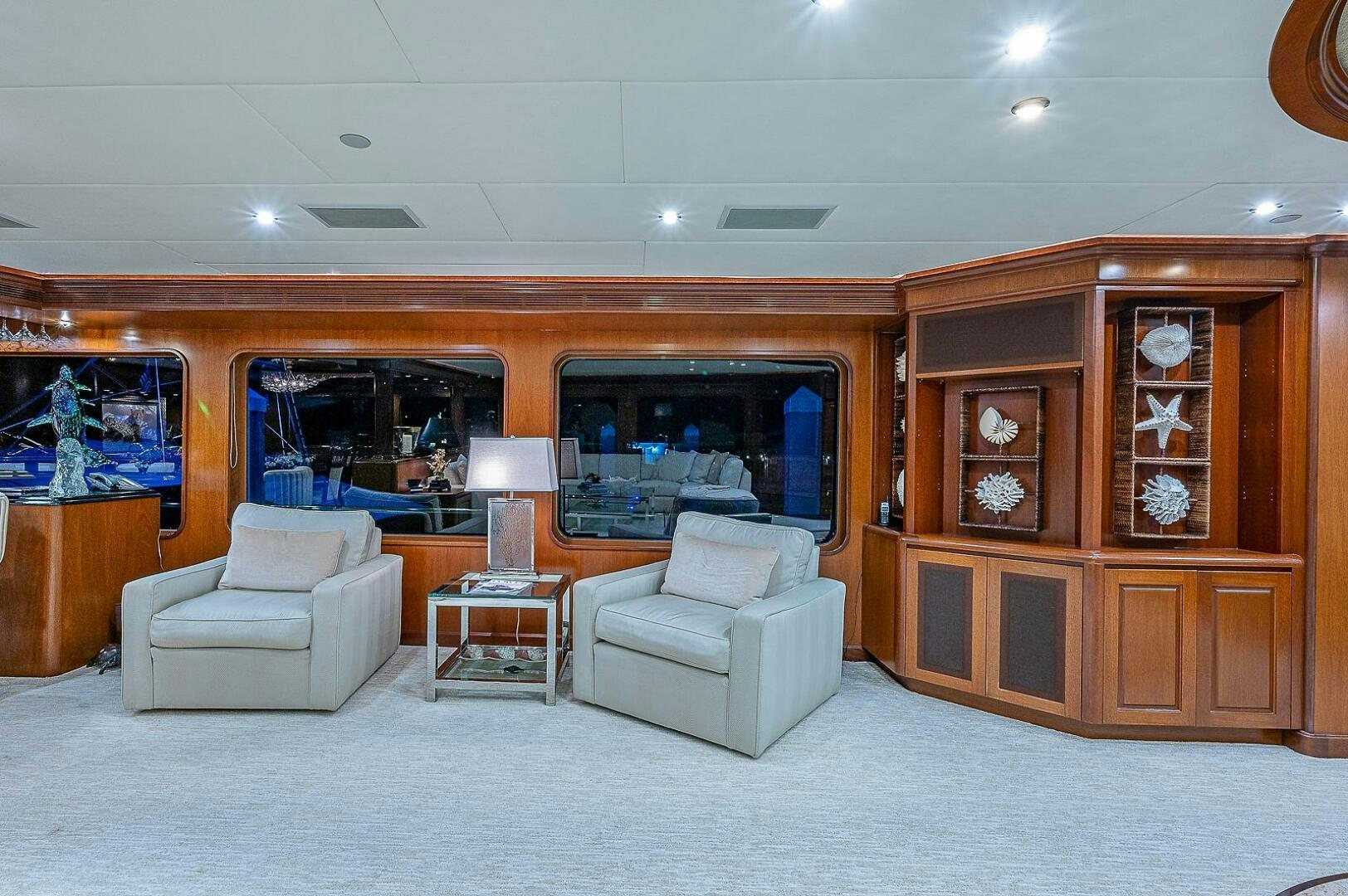 a living room with a large mirror aboard LA SIRENA Yacht for Sale