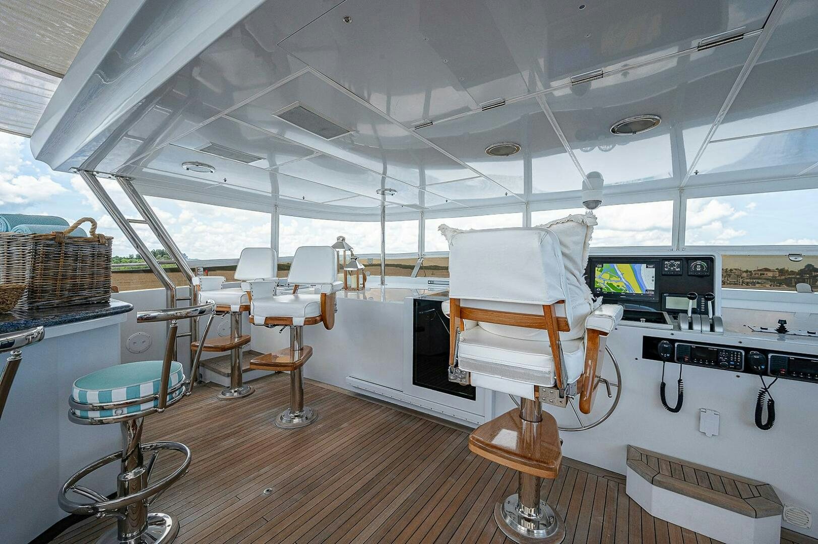 a room with tables and chairs aboard LA SIRENA Yacht for Sale