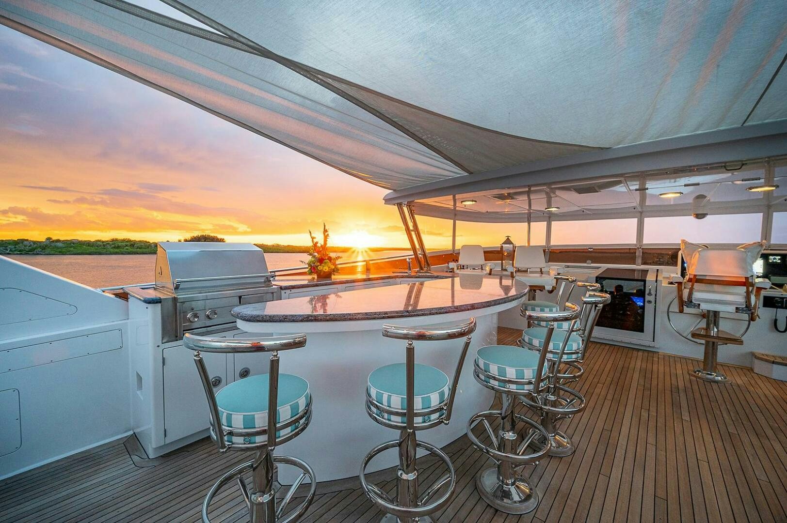 a large room with tables and chairs aboard LA SIRENA Yacht for Sale