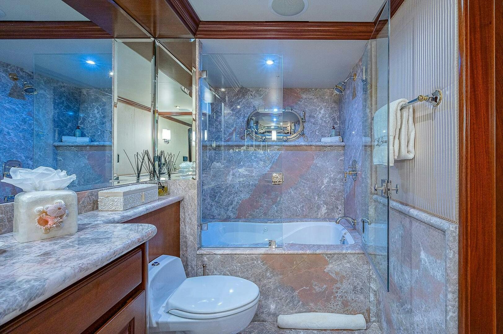 a bathroom with a glass shower aboard LA SIRENA Yacht for Sale