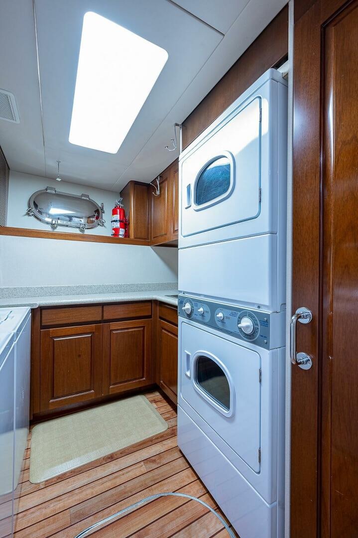 a kitchen with a microwave oven and cabinets aboard LA SIRENA Yacht for Sale