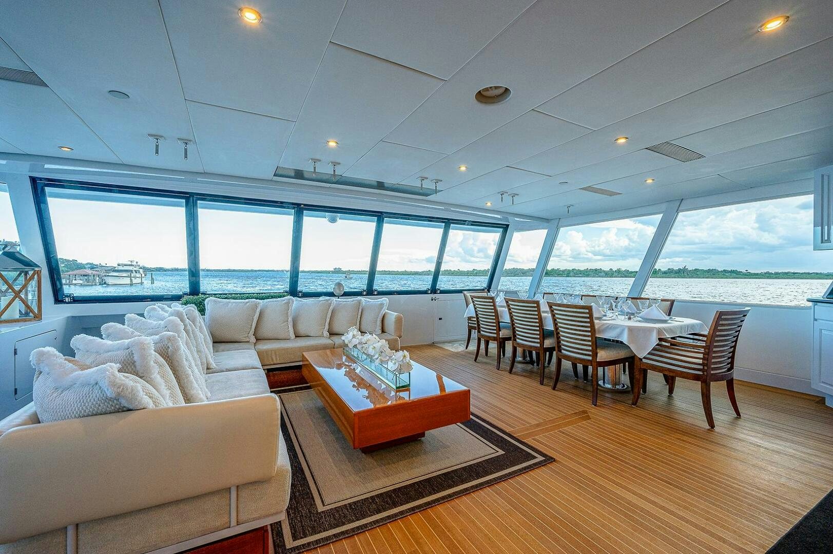 a living room with a large window aboard LA SIRENA Yacht for Sale