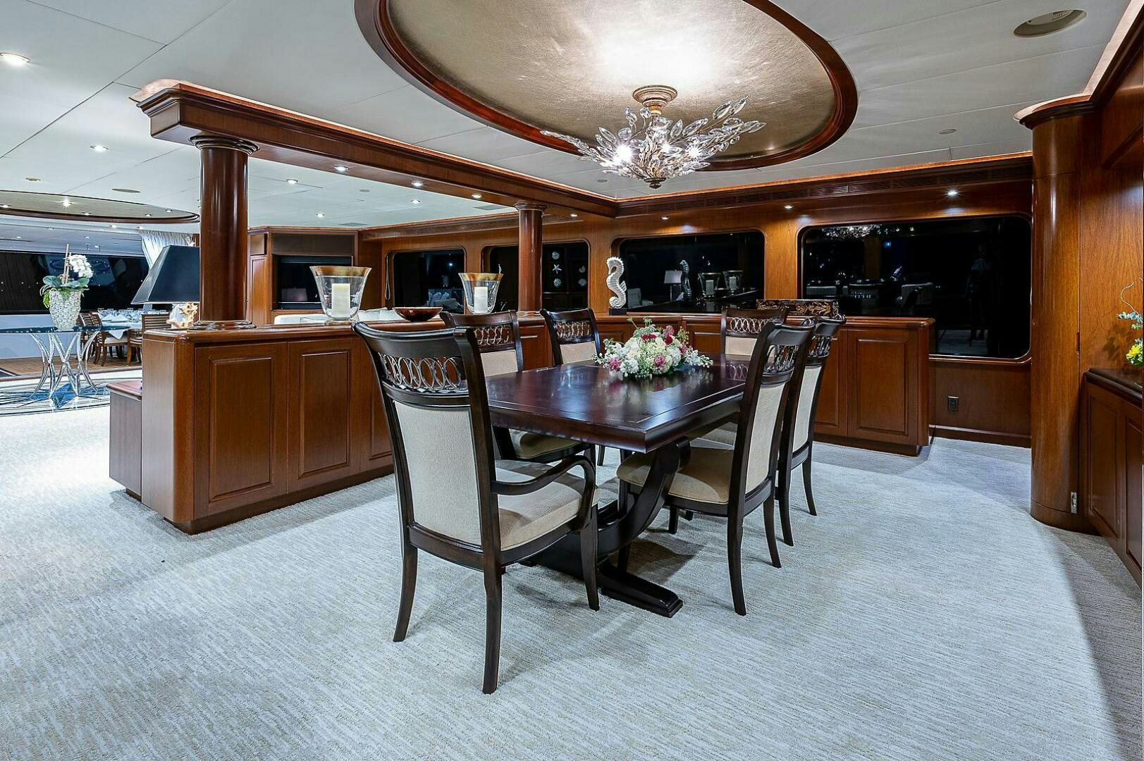 a dining room with a table and chairs aboard LA SIRENA Yacht for Sale