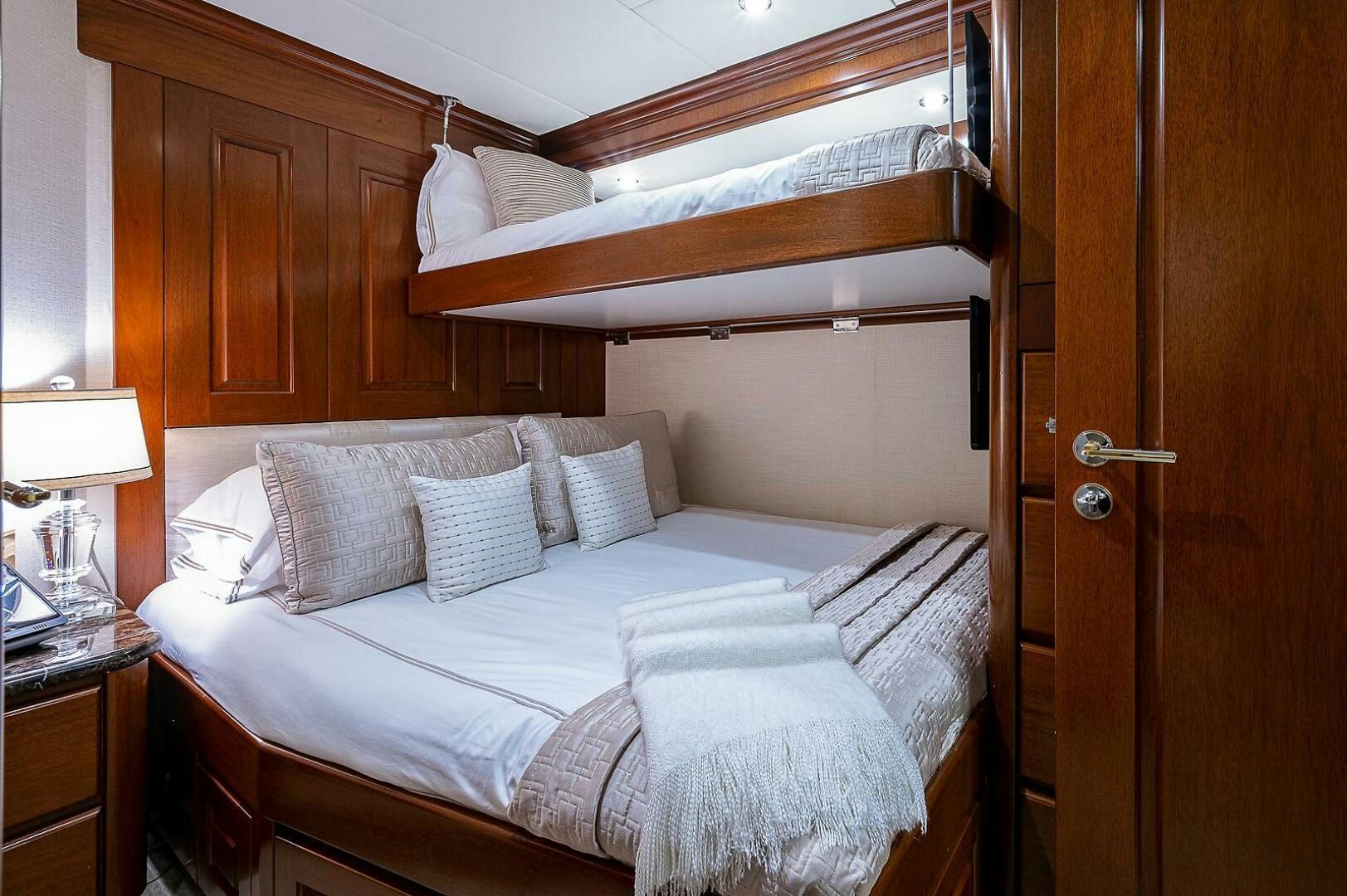 a bed with white sheets aboard LA SIRENA Yacht for Sale