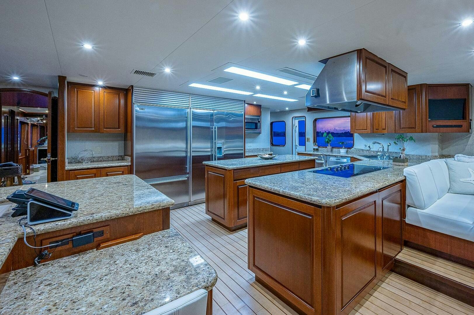 a large kitchen with a large glass wall aboard LA SIRENA Yacht for Sale