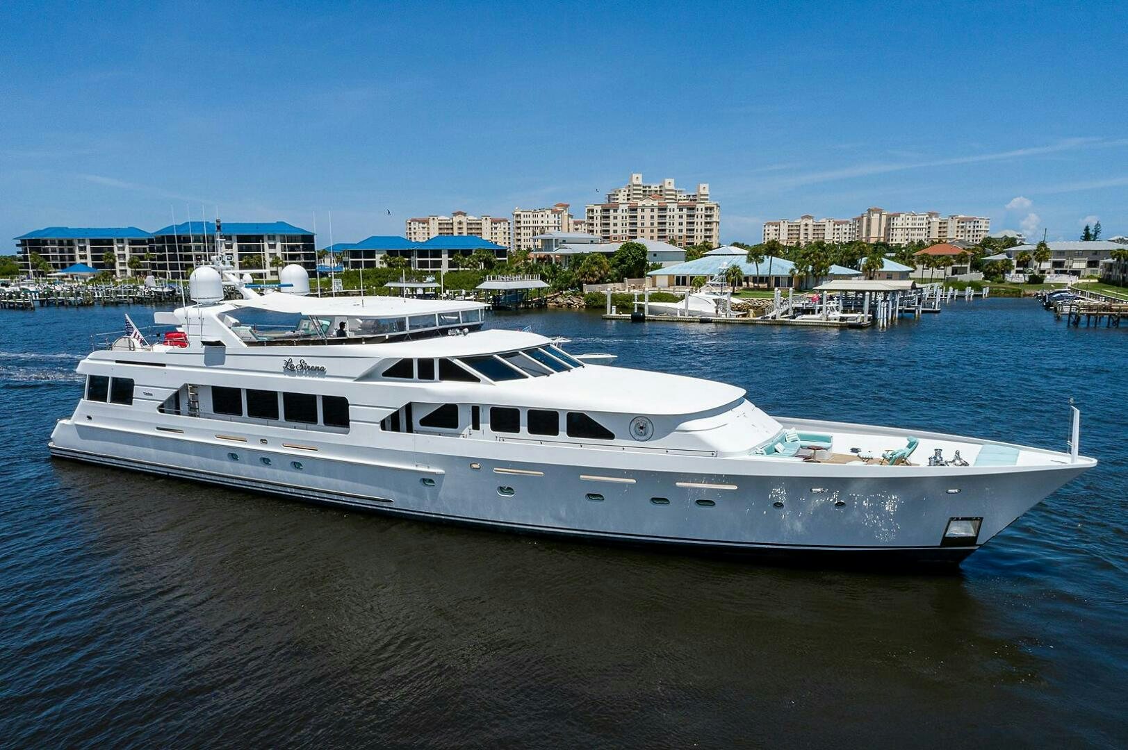 a large white boat in the water aboard LA SIRENA Yacht for Sale