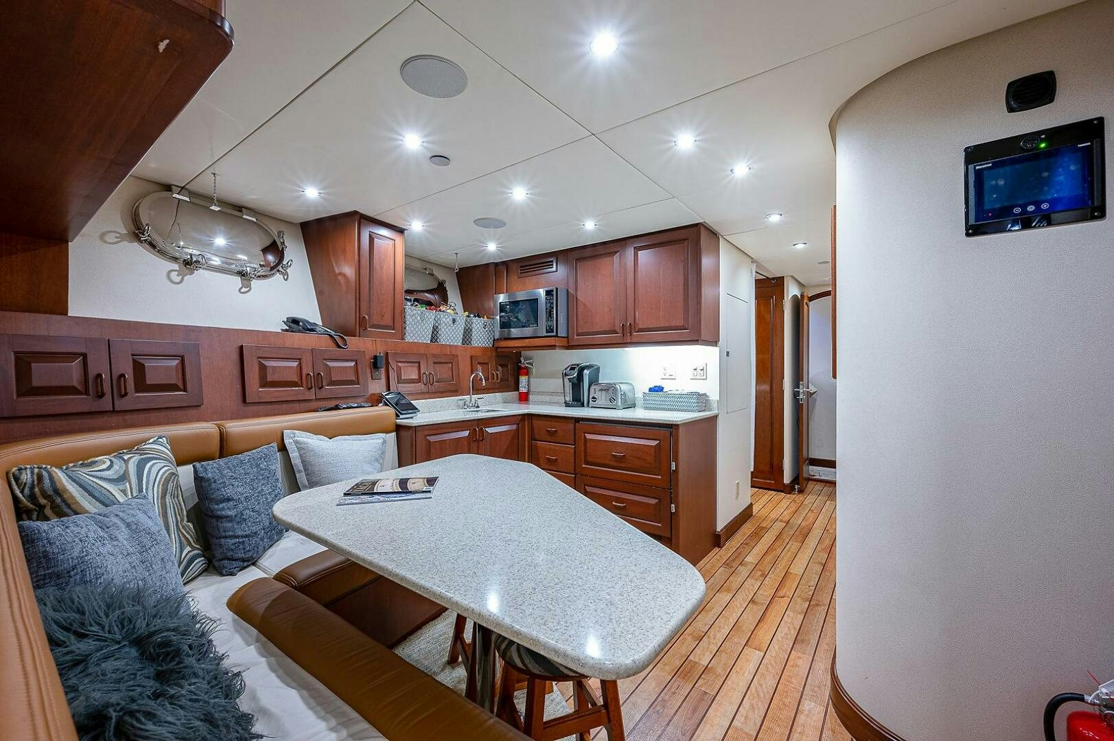 a living room with a couch and a table aboard LA SIRENA Yacht for Sale