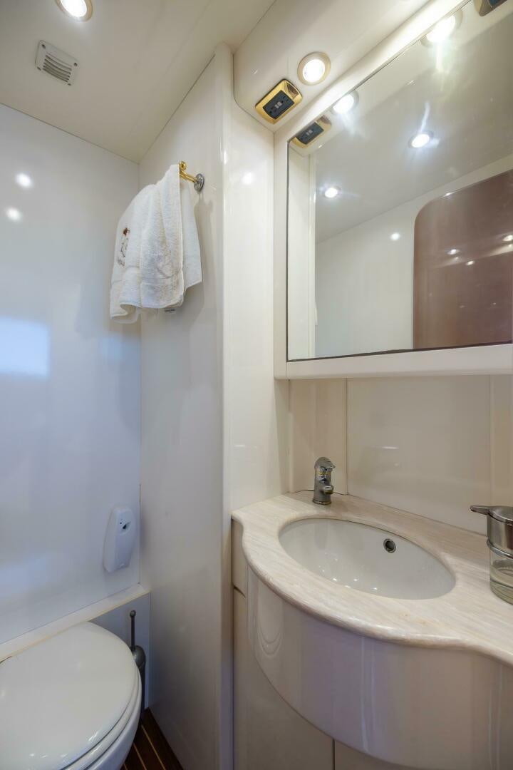 a bathroom with a sink and a mirror aboard ONE MORE TIME Yacht for Sale