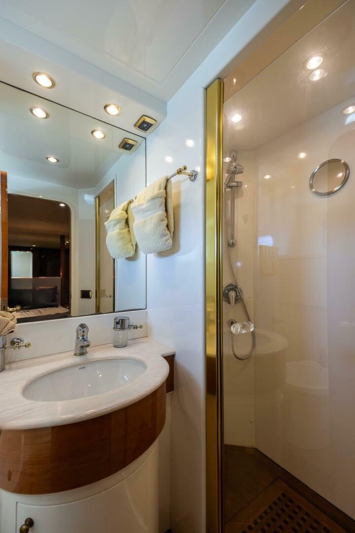 a bathroom with a shower unit and sink aboard ONE MORE TIME Yacht for Sale