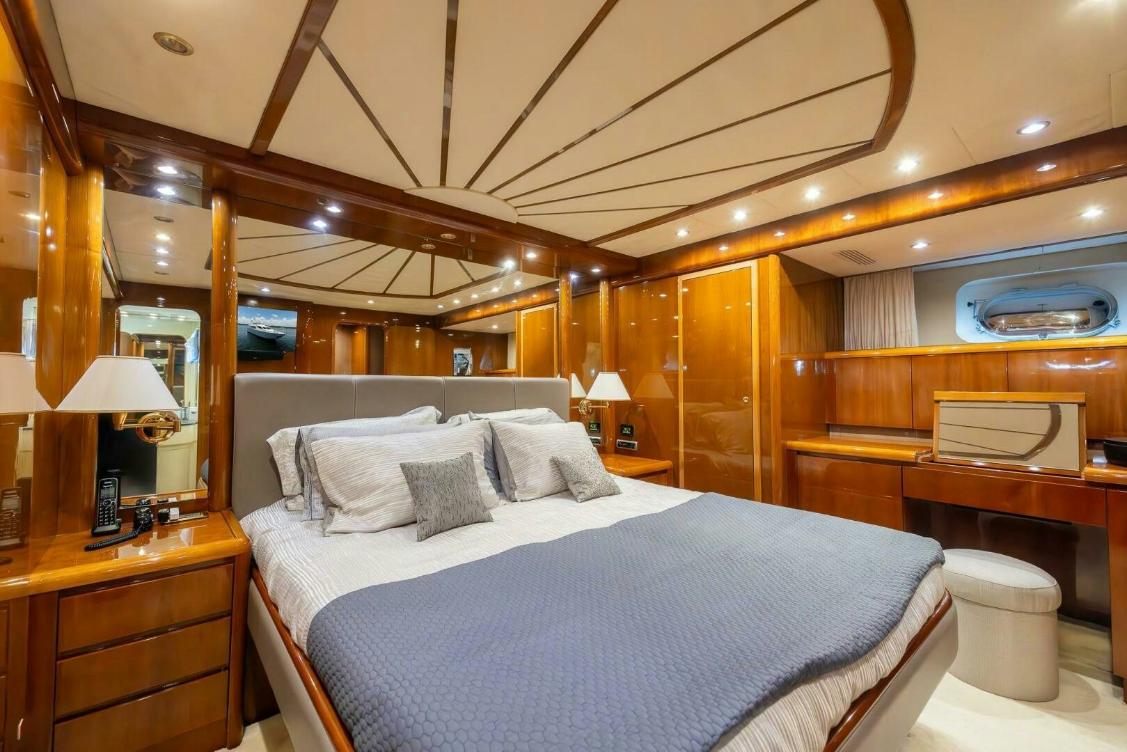 a bedroom with a large bed aboard ONE MORE TIME Yacht for Sale