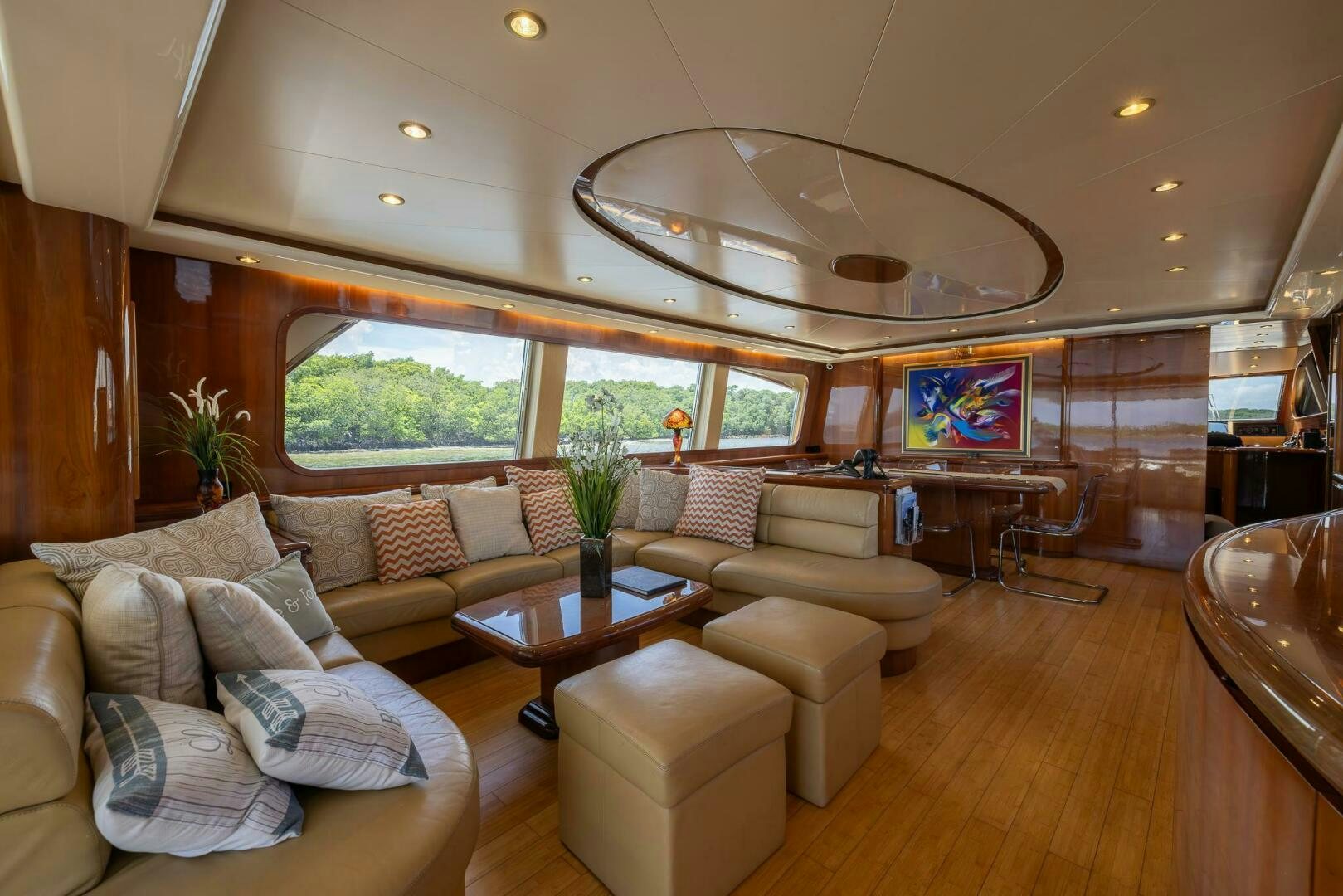 a living room with a large chandelier aboard ONE MORE TIME Yacht for Sale