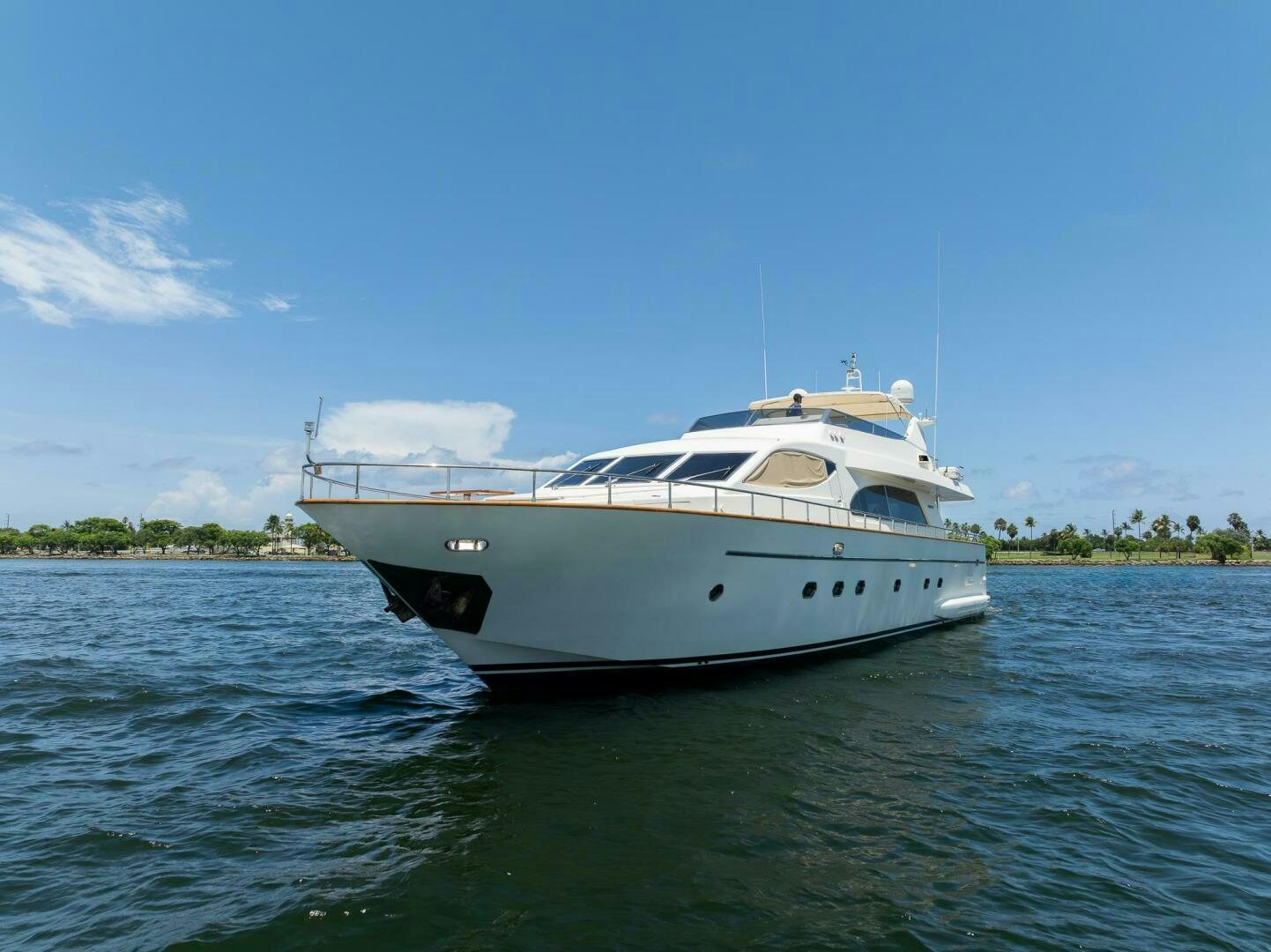 a white boat on the water aboard ONE MORE TIME Yacht for Sale