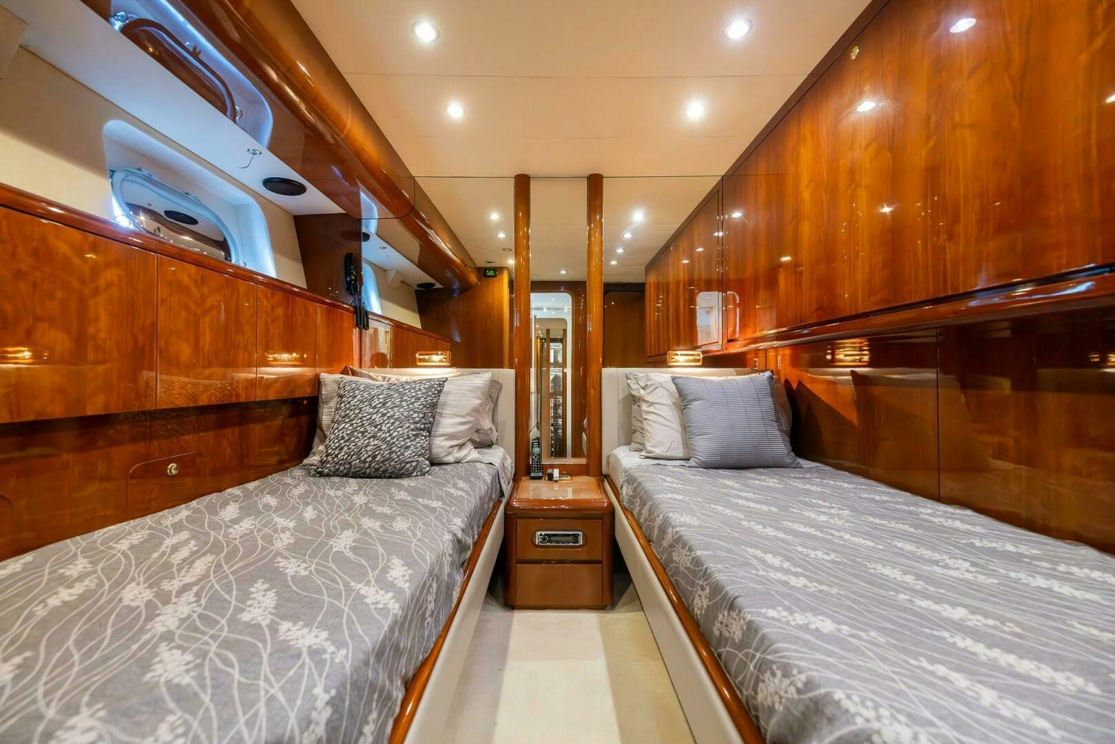 a room with a bed and a wood wall aboard ONE MORE TIME Yacht for Sale