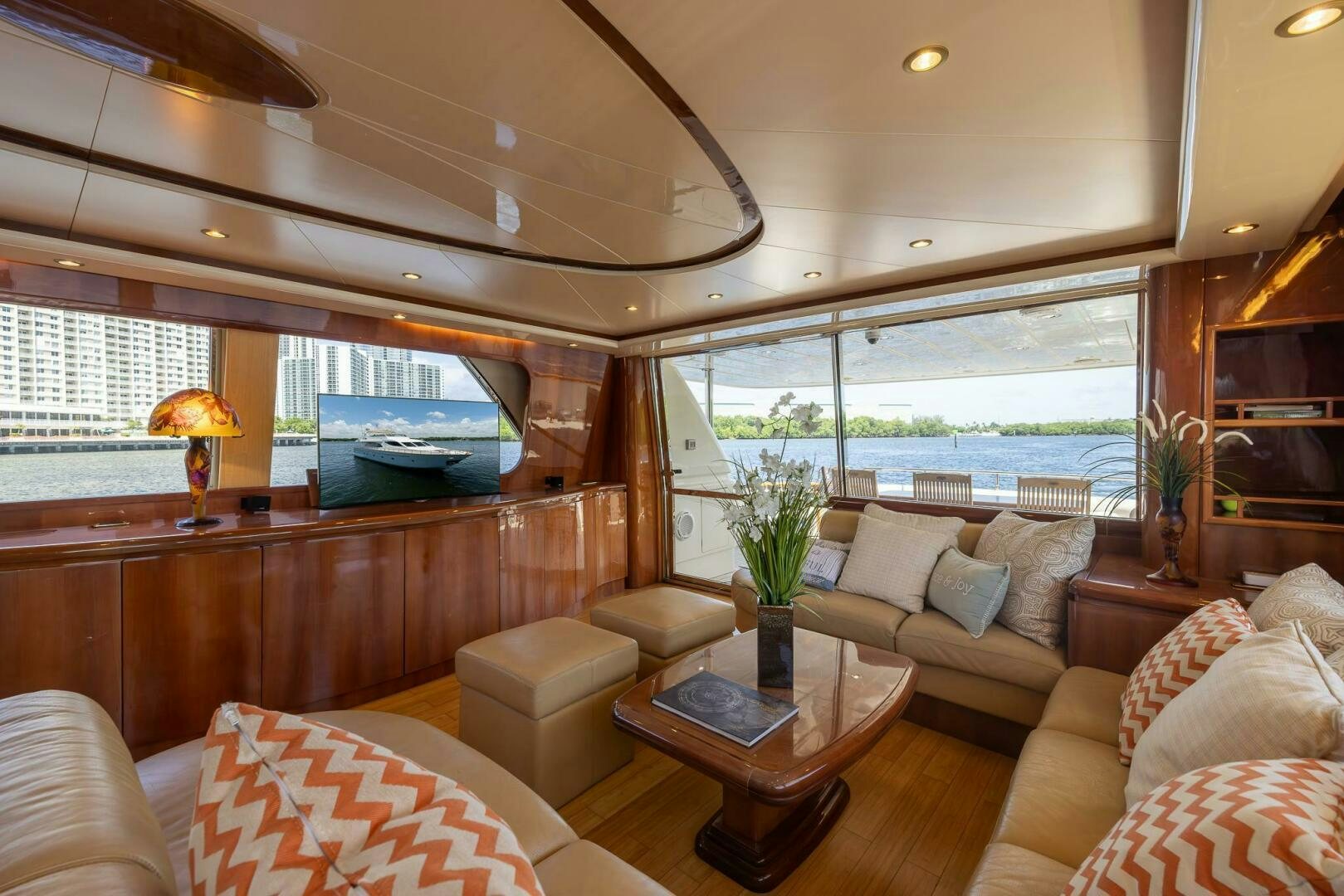 a living room with a large window aboard ONE MORE TIME Yacht for Sale
