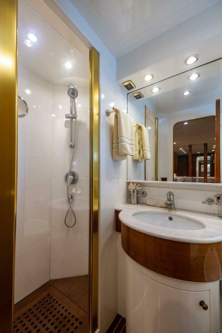 a bathroom with a shower and sink aboard ONE MORE TIME Yacht for Sale