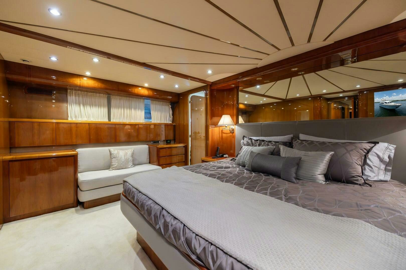 a large bed in a room aboard ONE MORE TIME Yacht for Sale