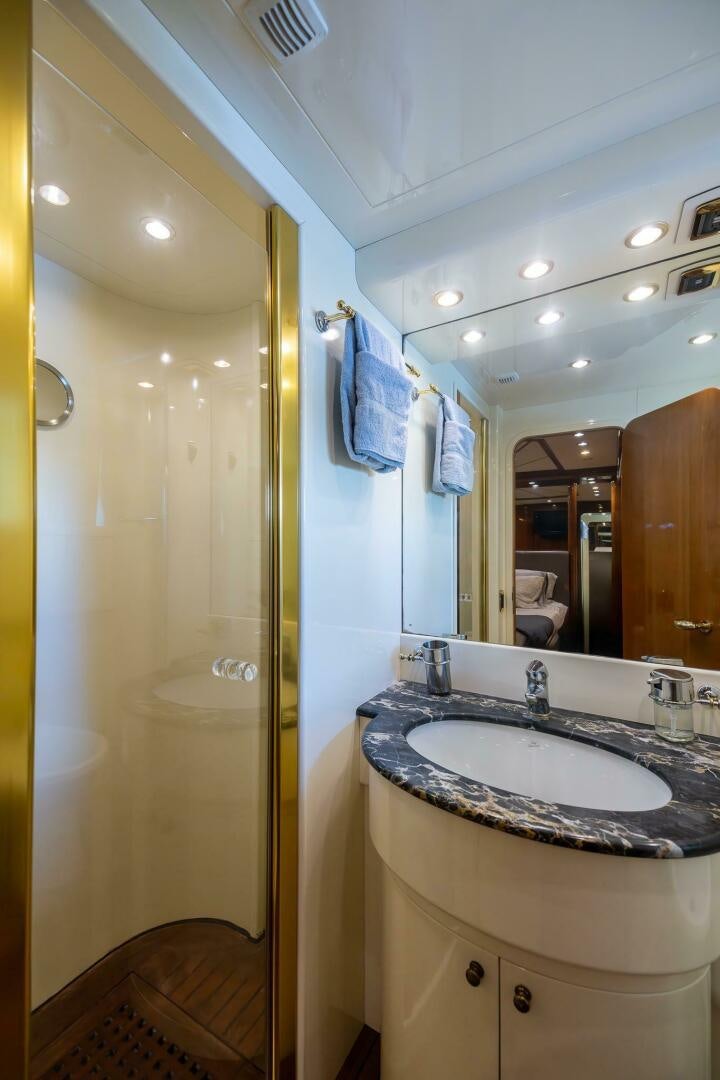 a bathroom with a sink and a shower aboard ONE MORE TIME Yacht for Sale