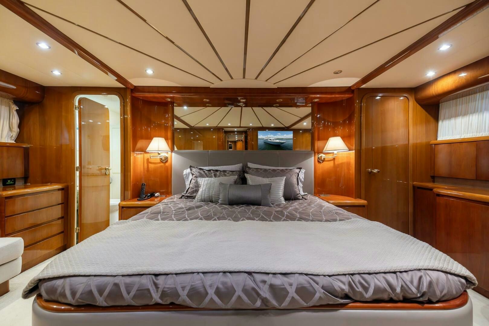 a large bed in a cabin aboard ONE MORE TIME Yacht for Sale