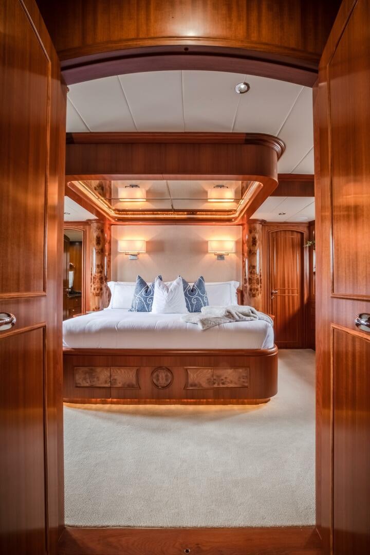 a bed in a room aboard KENTUCKY BELLE Yacht for Sale