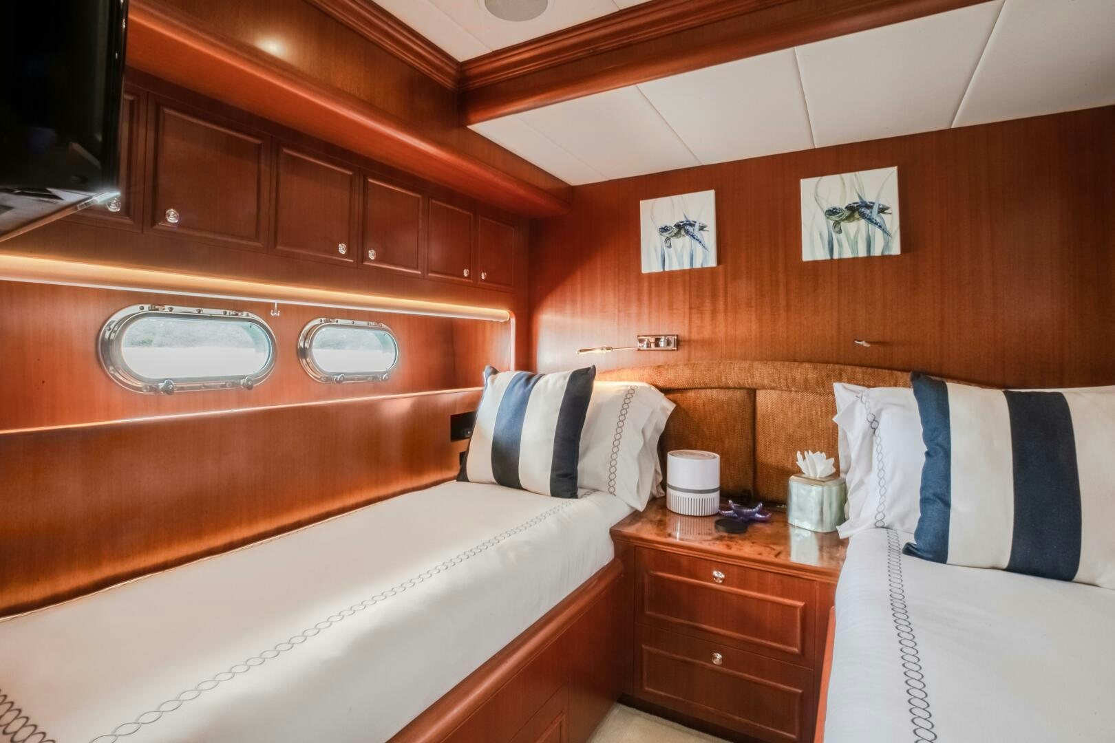 a bathroom with wooden cabinets aboard KENTUCKY BELLE Yacht for Sale