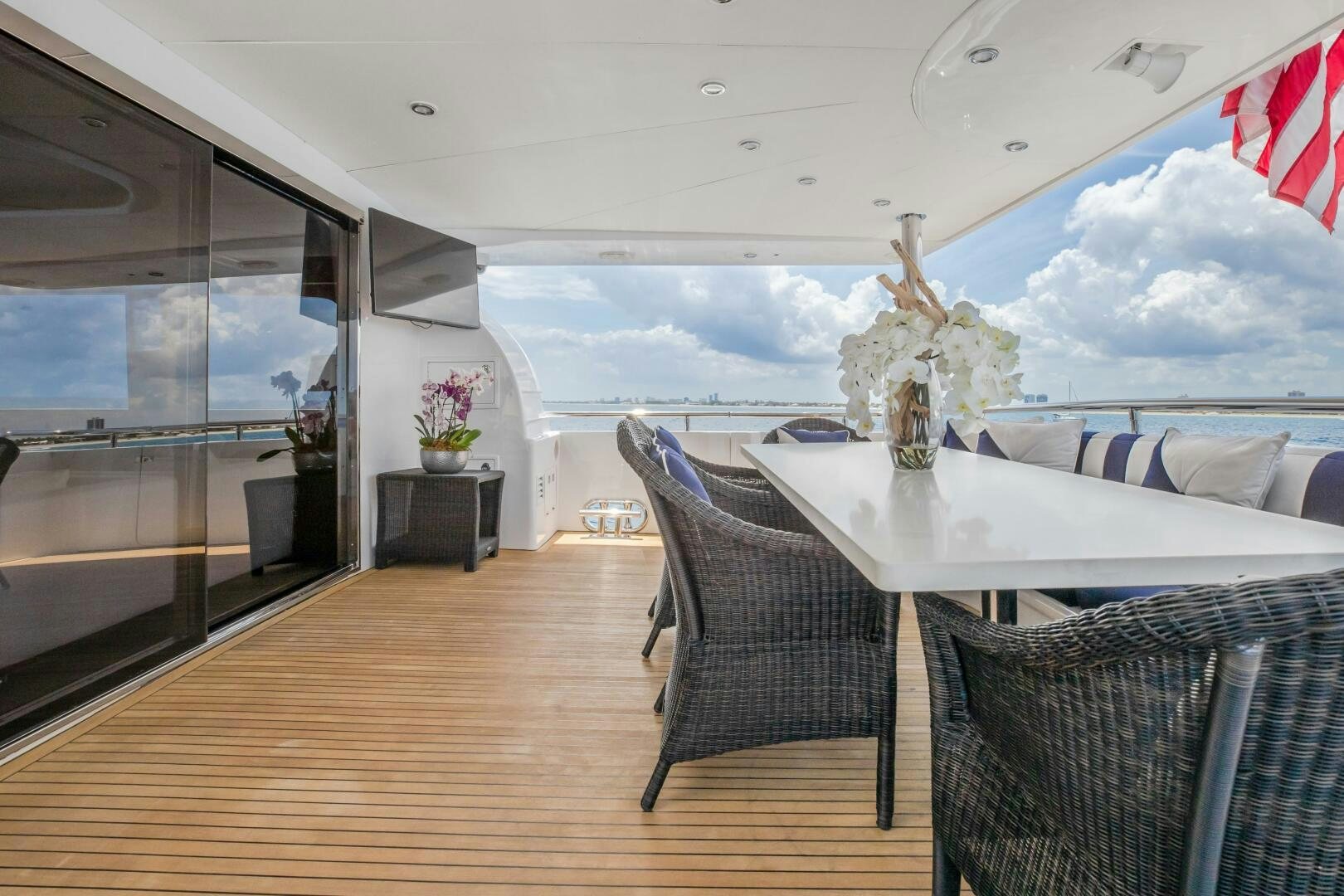 a room with a table chairs and a large window aboard KENTUCKY BELLE Yacht for Sale