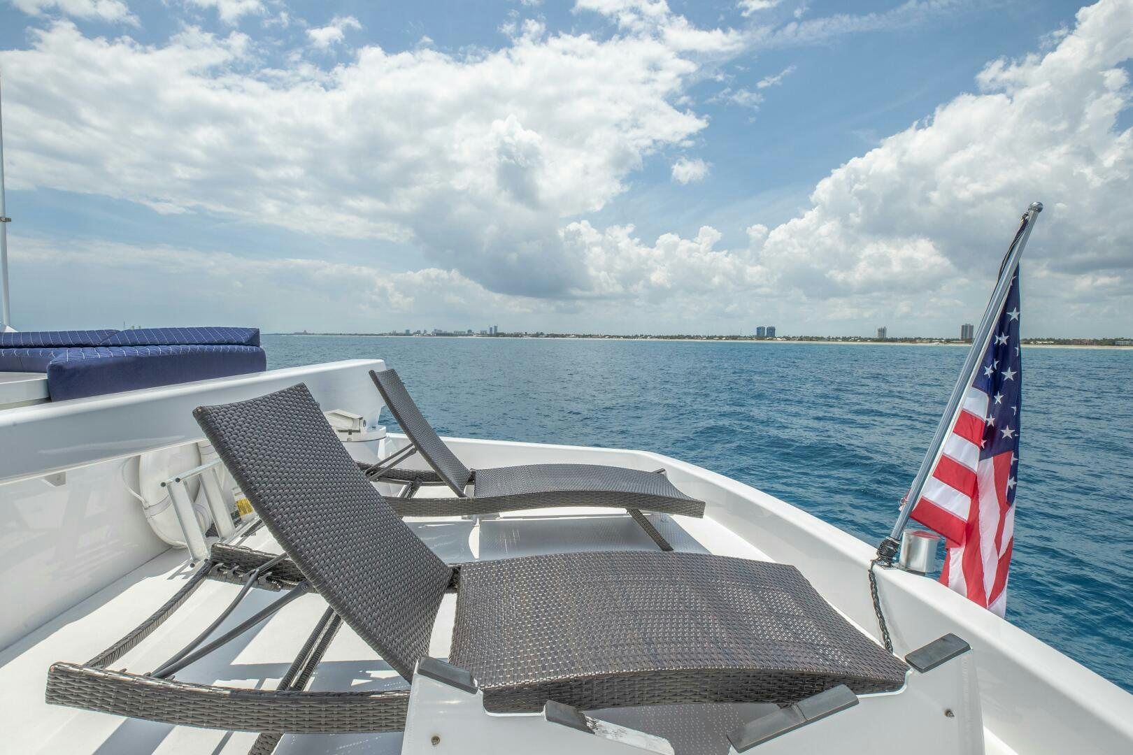 a boat with a flag on the front aboard KENTUCKY BELLE Yacht for Sale
