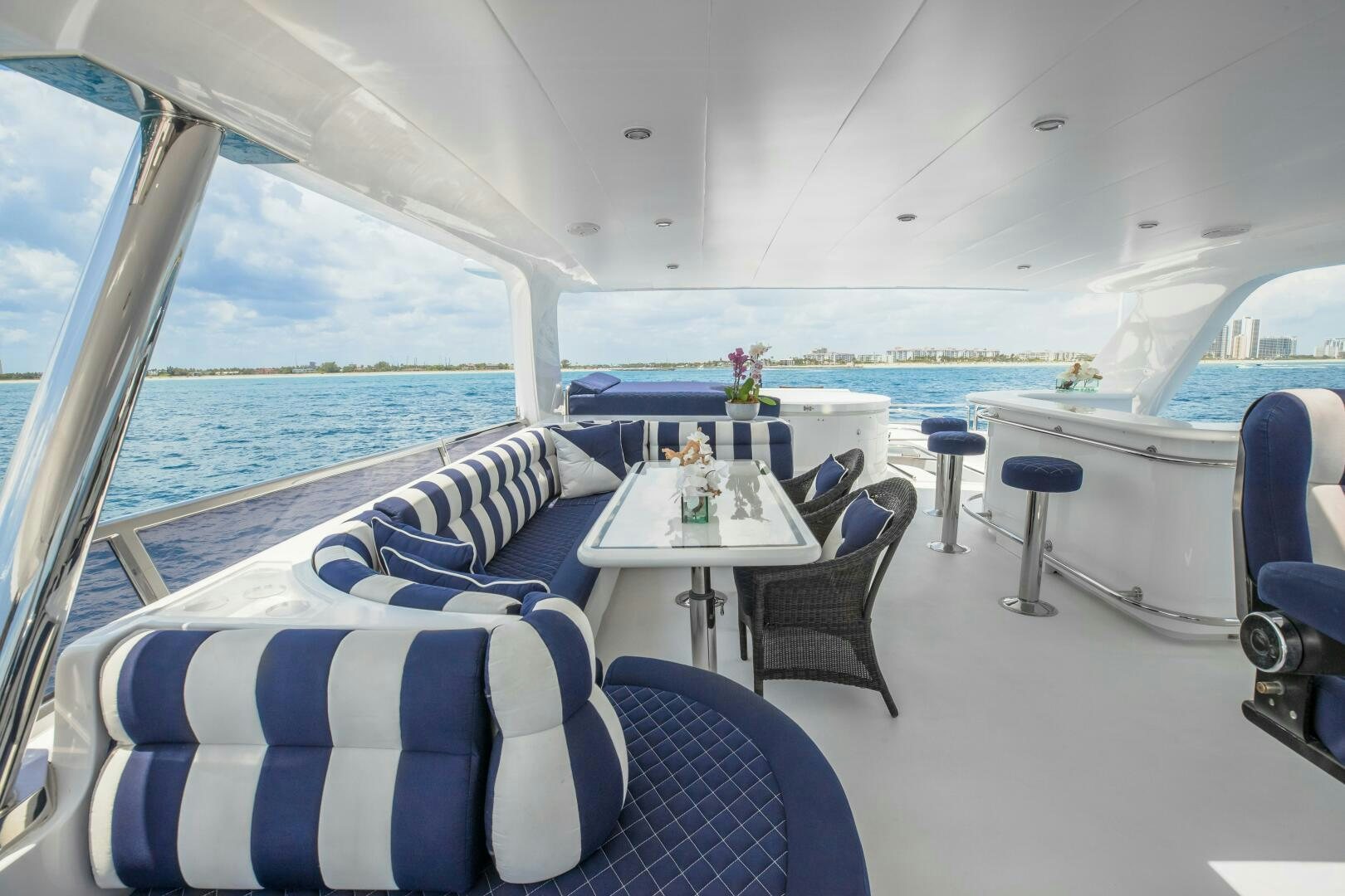 a room with a table and chairs aboard KENTUCKY BELLE Yacht for Sale