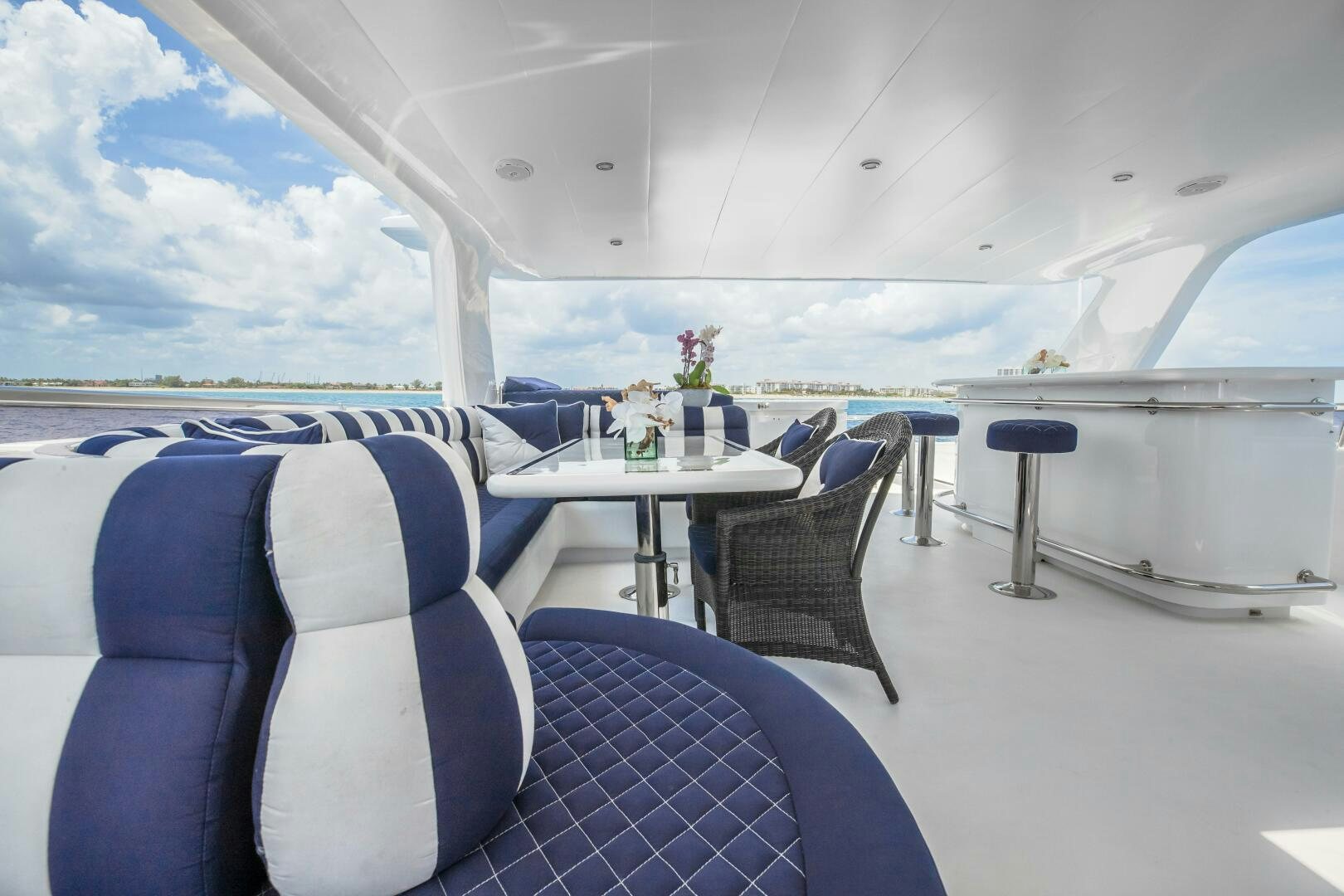a room with a table and chairs aboard KENTUCKY BELLE Yacht for Sale