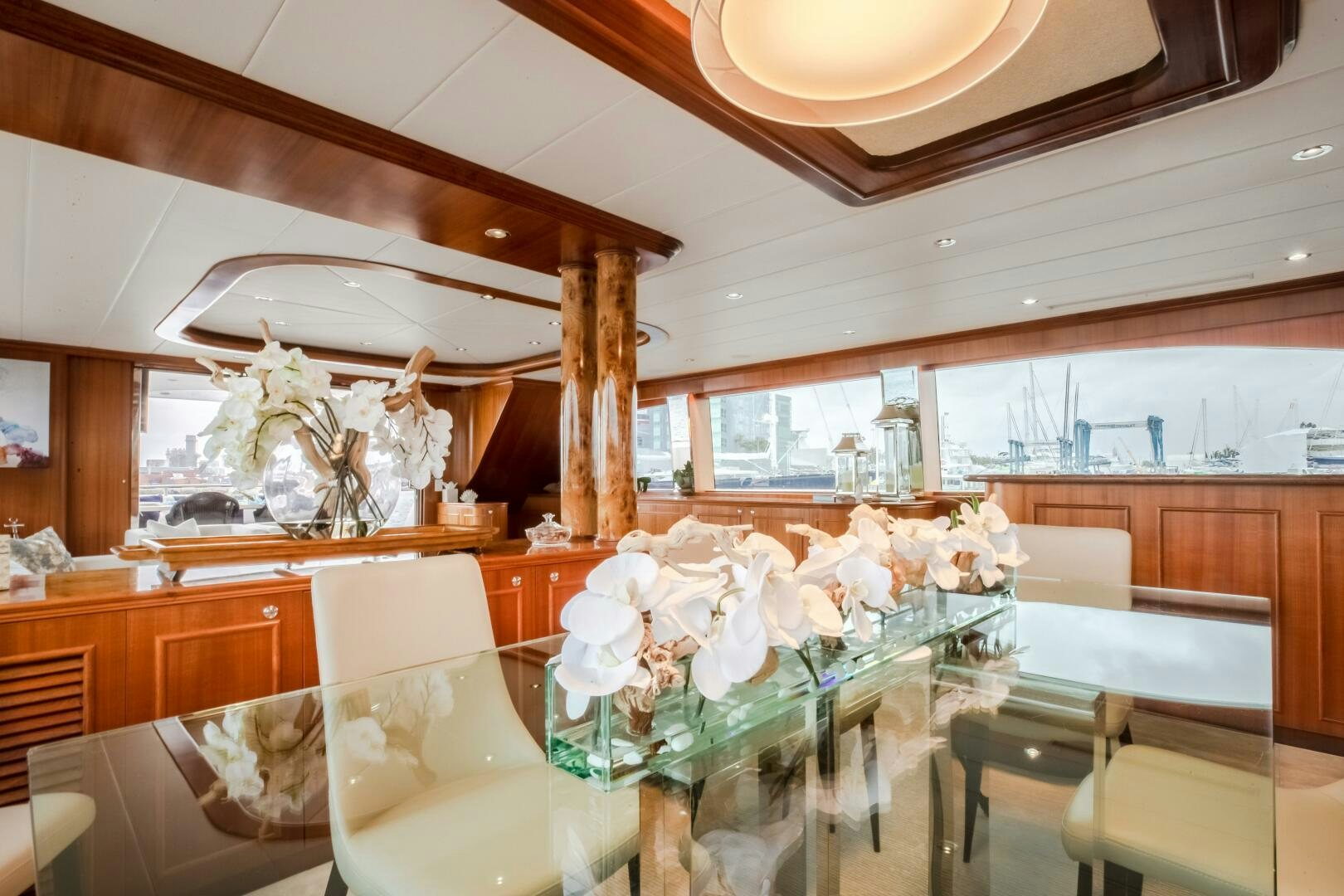 a room with a table and chairs aboard KENTUCKY BELLE Yacht for Sale