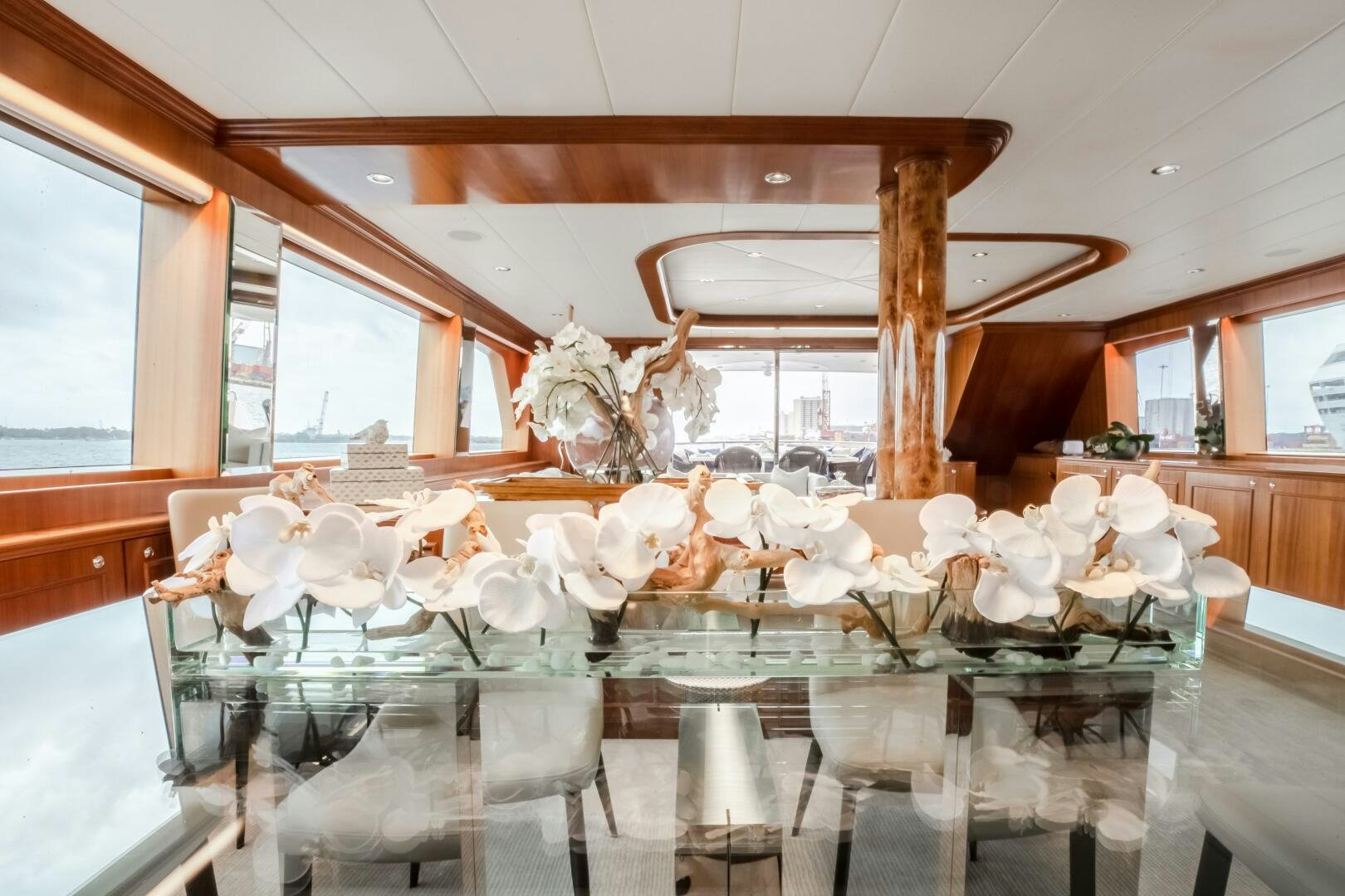 a large table with white flowers aboard KENTUCKY BELLE Yacht for Sale