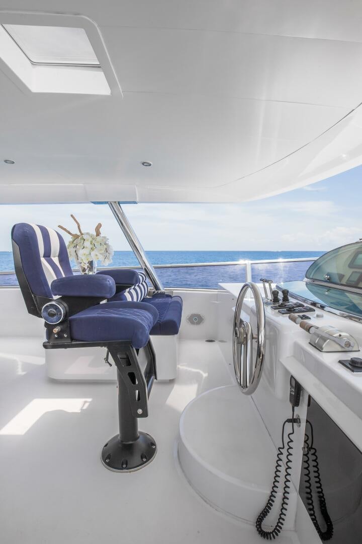a blue chair on a white surface aboard KENTUCKY BELLE Yacht for Sale