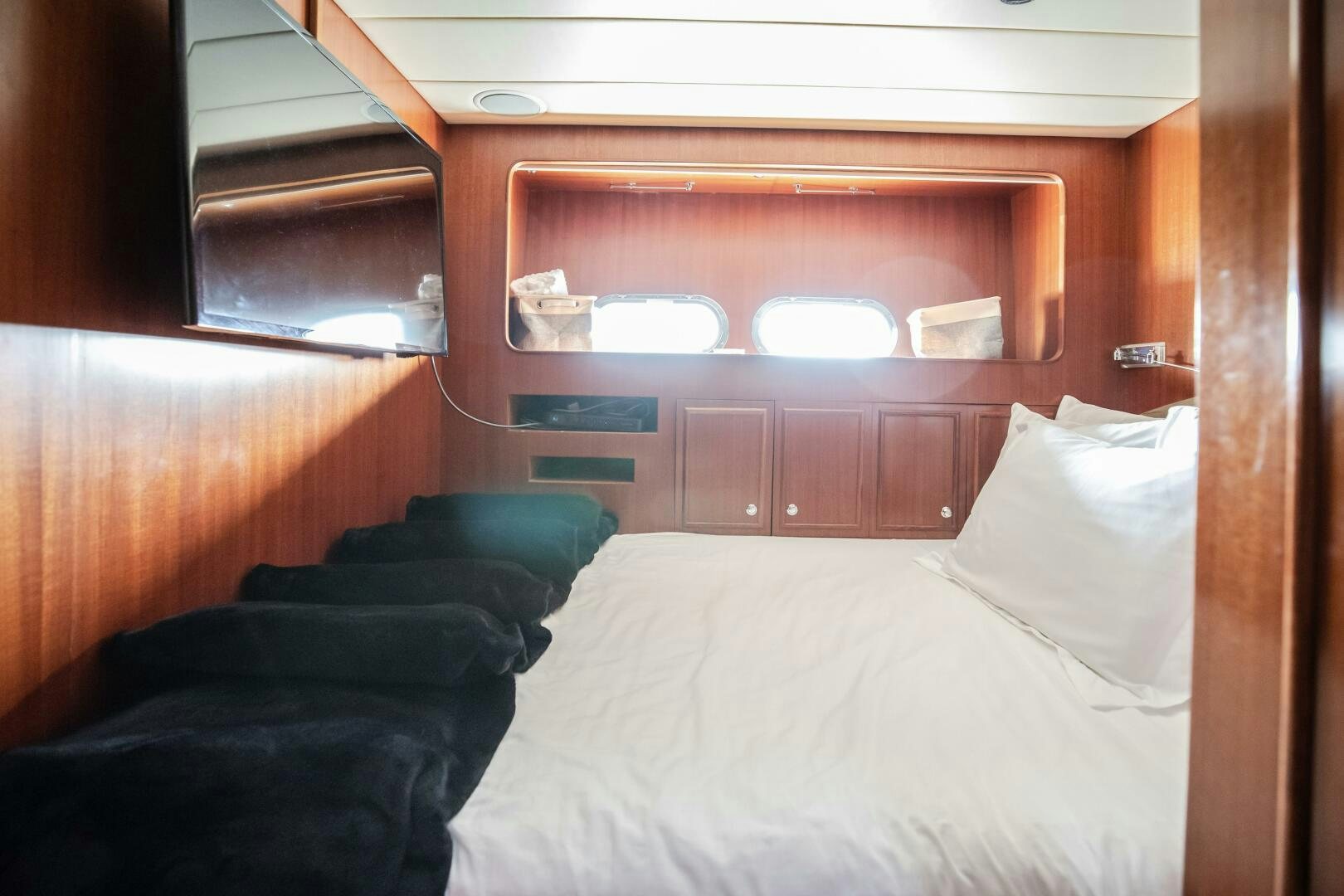 a room with a bed and a window aboard KENTUCKY BELLE Yacht for Sale
