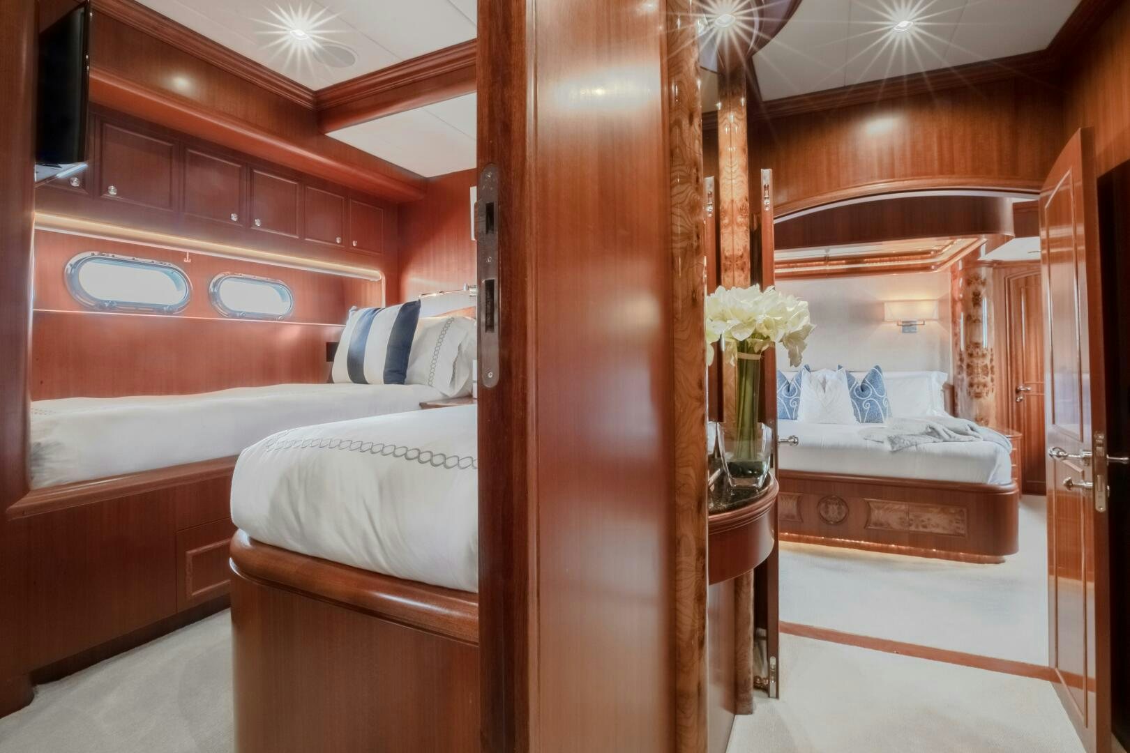 a room with a bed and a mirror aboard KENTUCKY BELLE Yacht for Sale