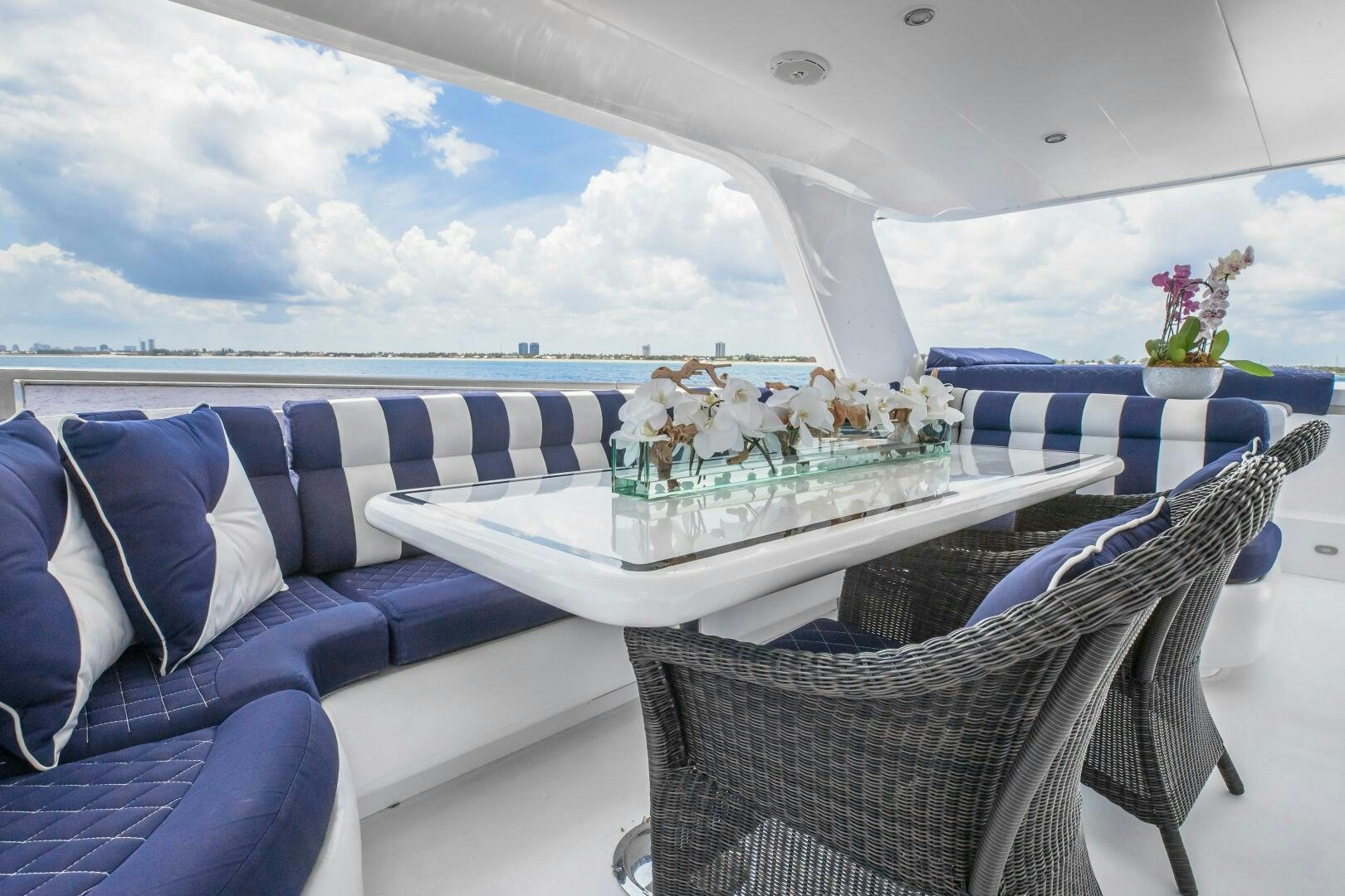 a table with a basket of flowers on it aboard KENTUCKY BELLE Yacht for Sale
