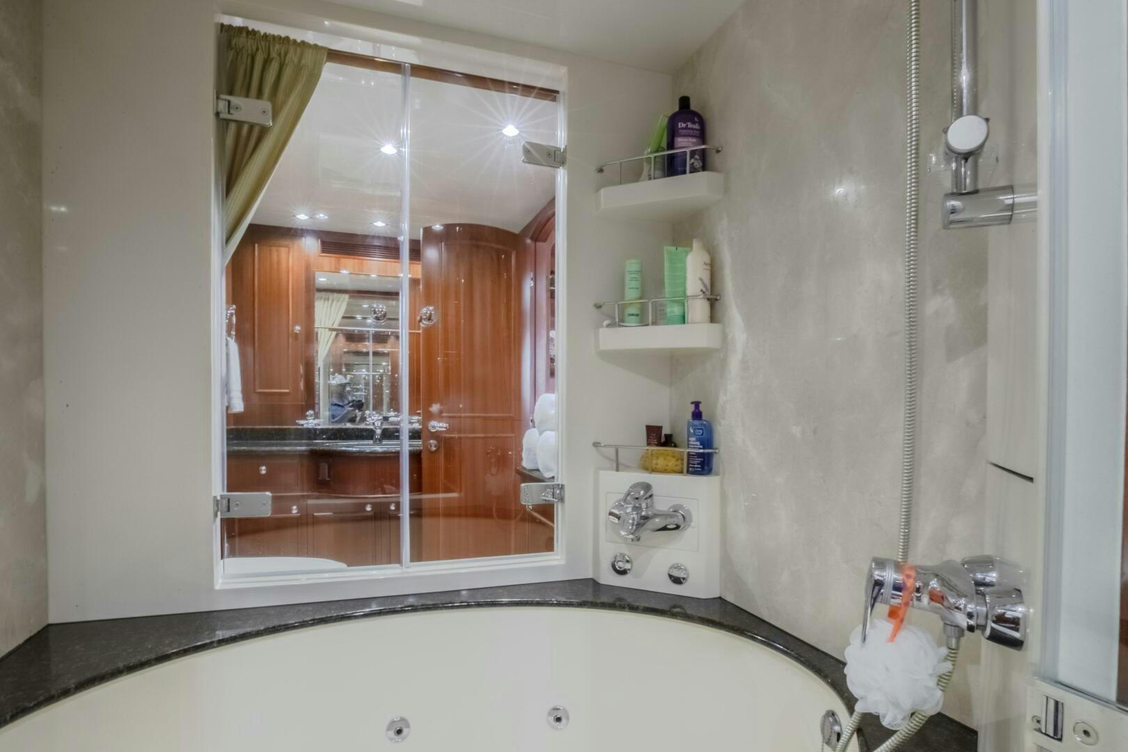a bathroom with a large mirror aboard KENTUCKY BELLE Yacht for Sale