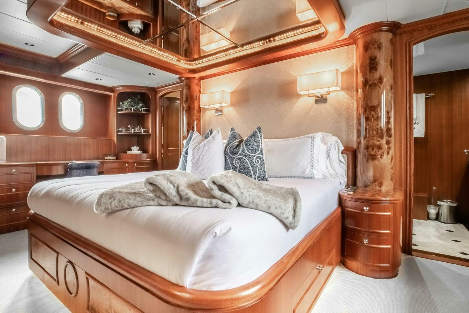 a bed with a white pillow aboard KENTUCKY BELLE Yacht for Sale
