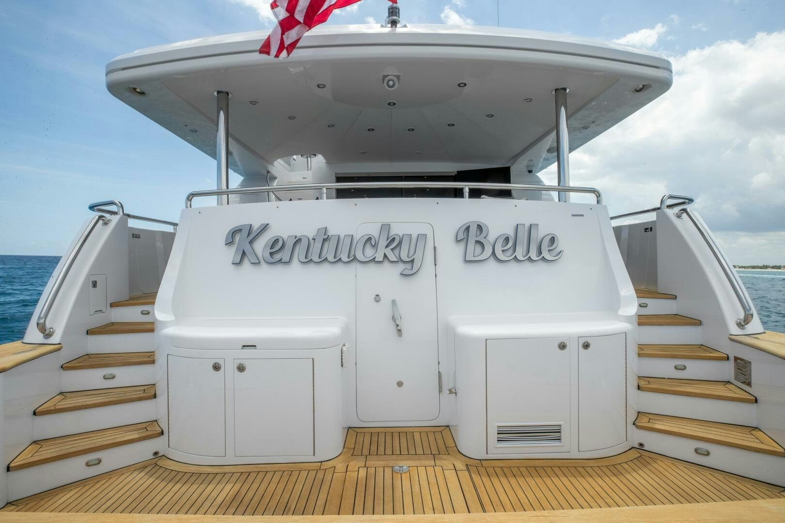 a white boat on a dock aboard KENTUCKY BELLE Yacht for Sale