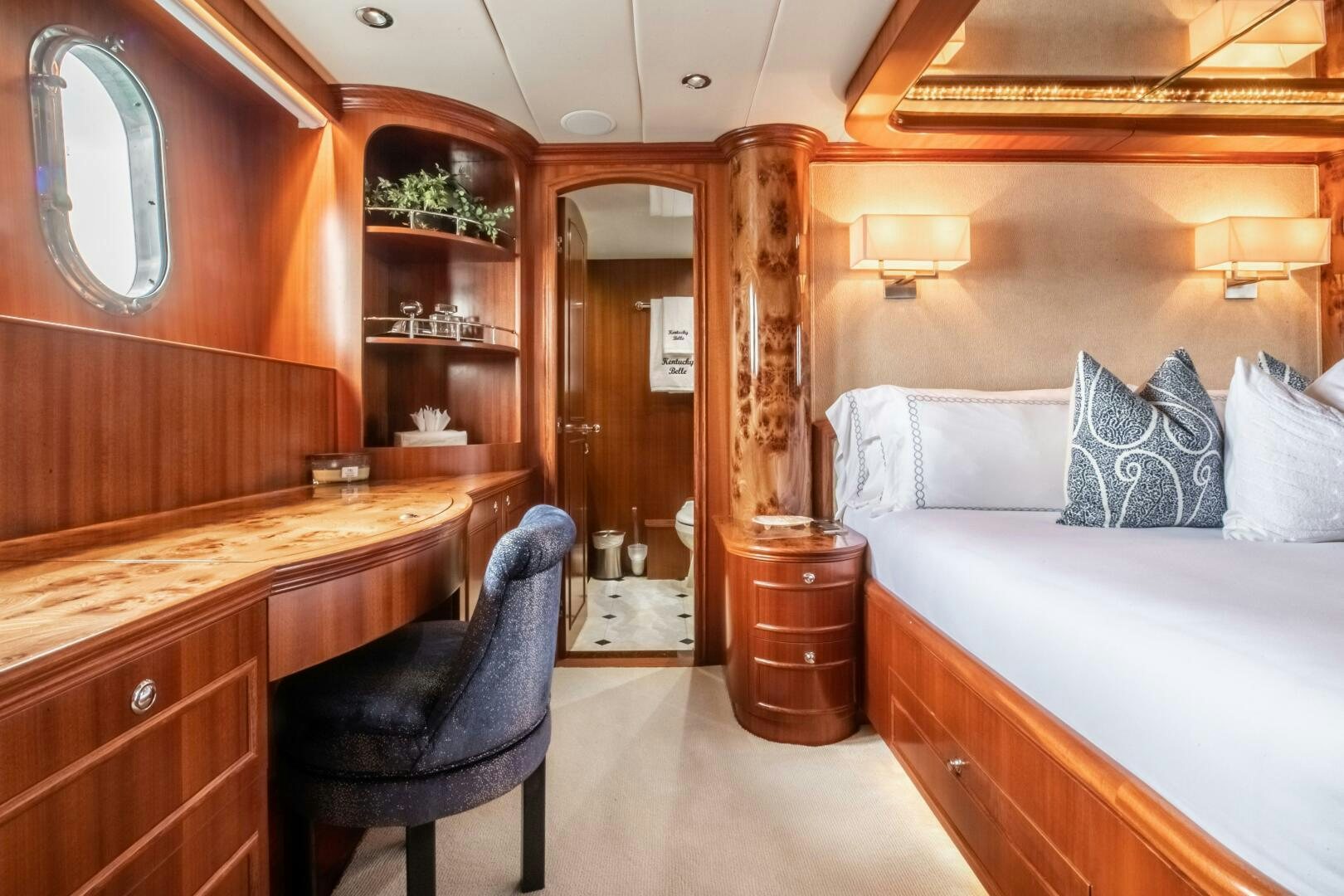 a room with a bed and a desk aboard KENTUCKY BELLE Yacht for Sale
