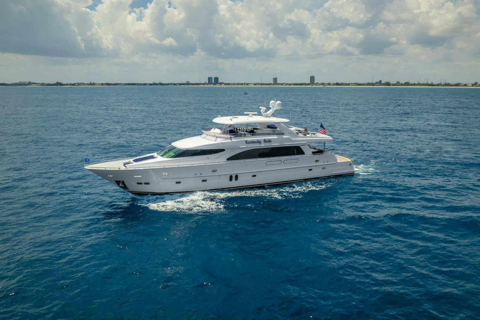 a white yacht in the water aboard KENTUCKY BELLE Yacht for Sale