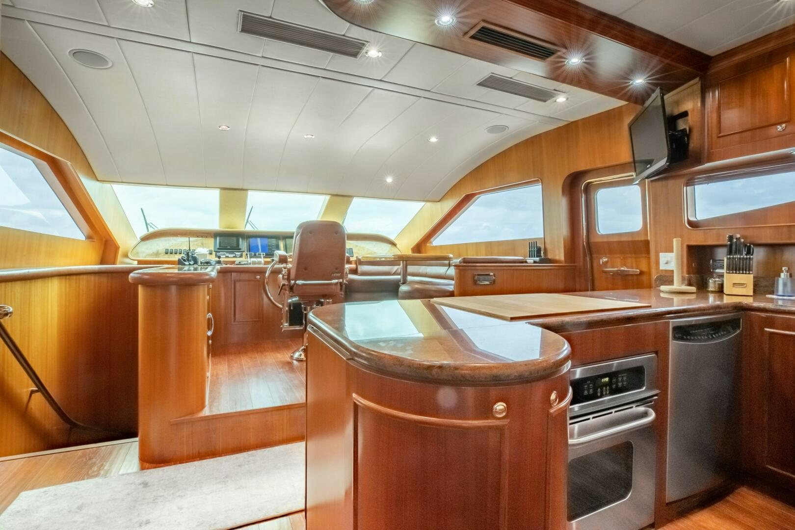a kitchen with wooden cabinets aboard KENTUCKY BELLE Yacht for Sale