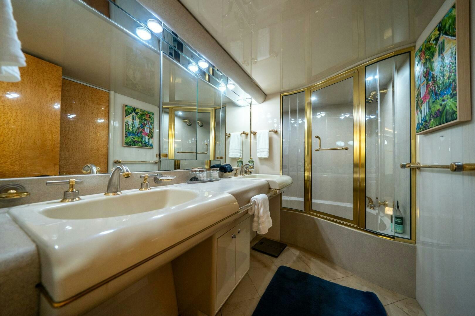a bathroom with a large mirror aboard PRESTIGE WORLDWIDE Yacht for Sale