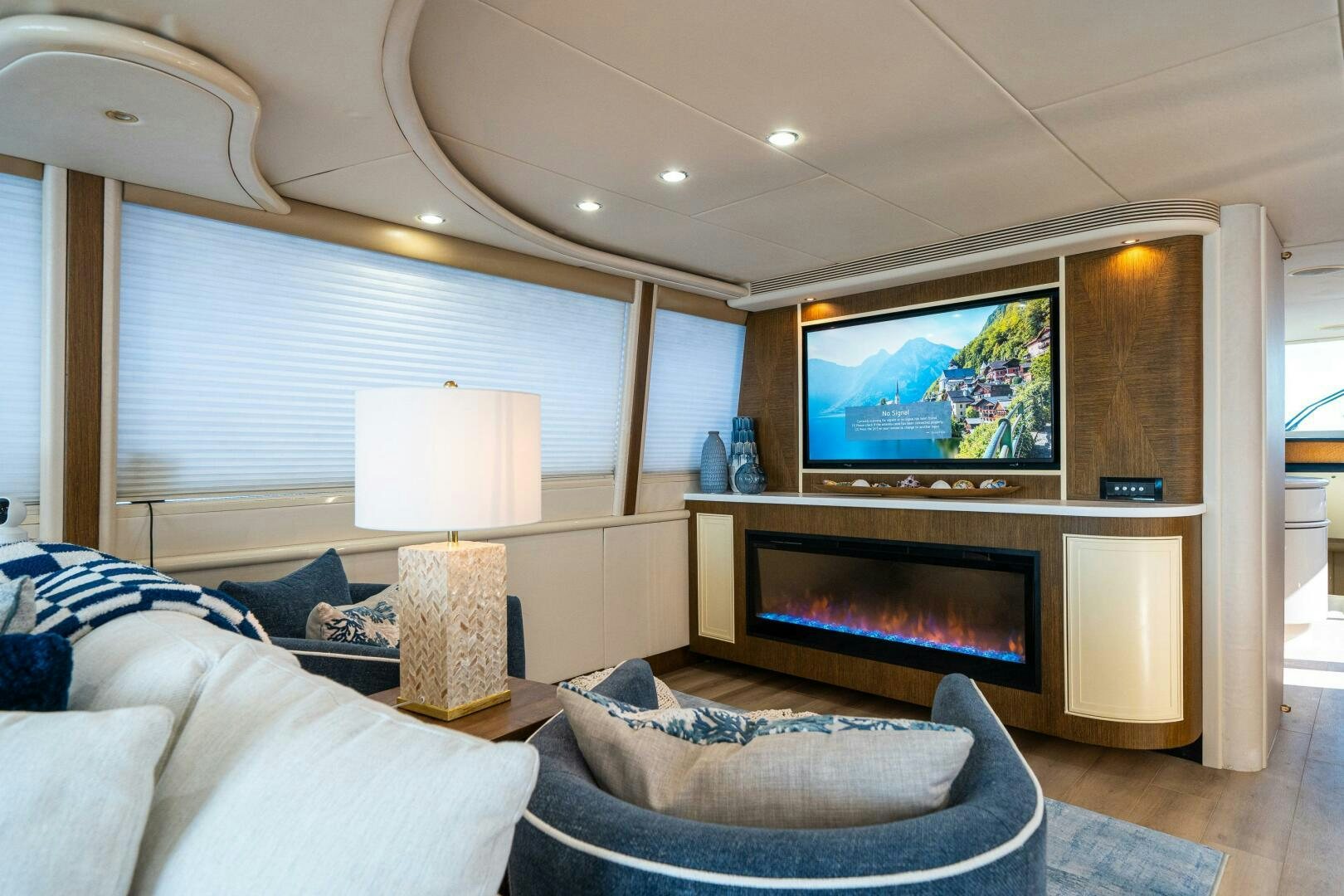 a living room with a fireplace aboard PRESTIGE WORLDWIDE Yacht for Sale